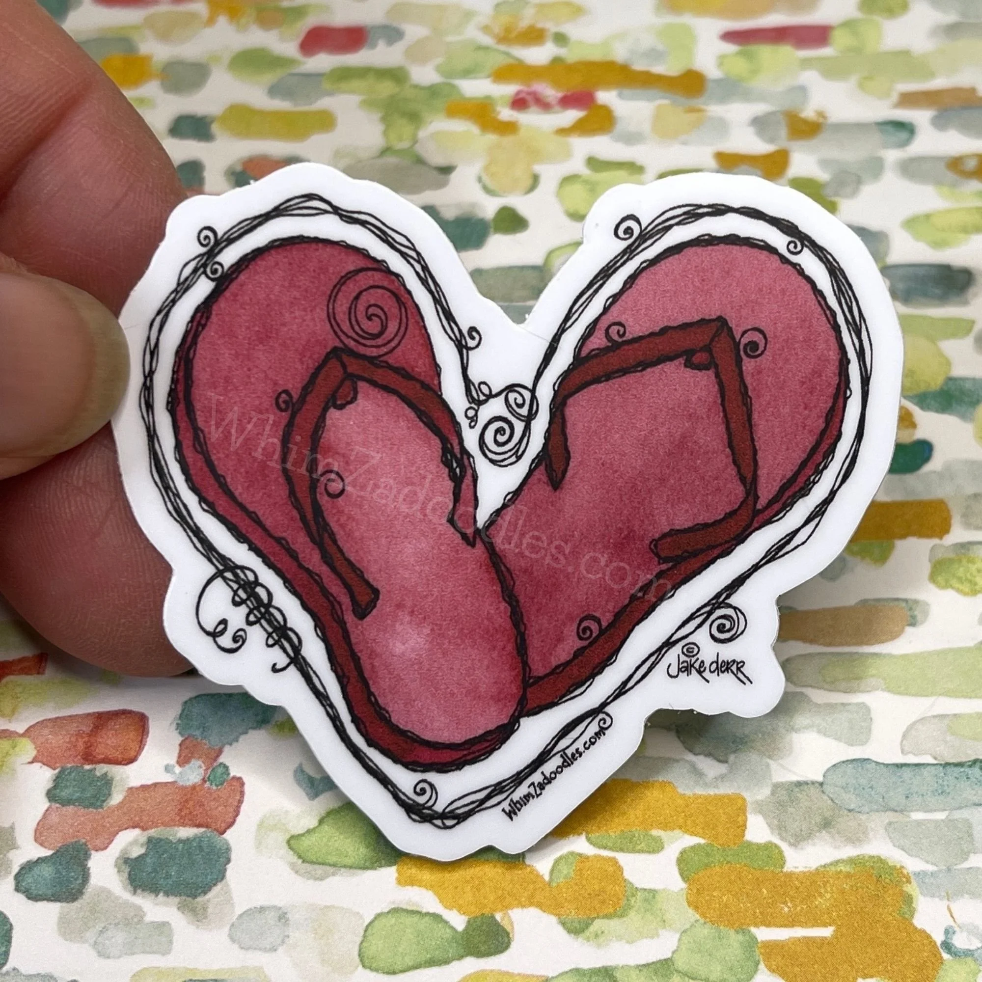 Hand holding flip-flop heart to demonstrate real-life scale and proportions