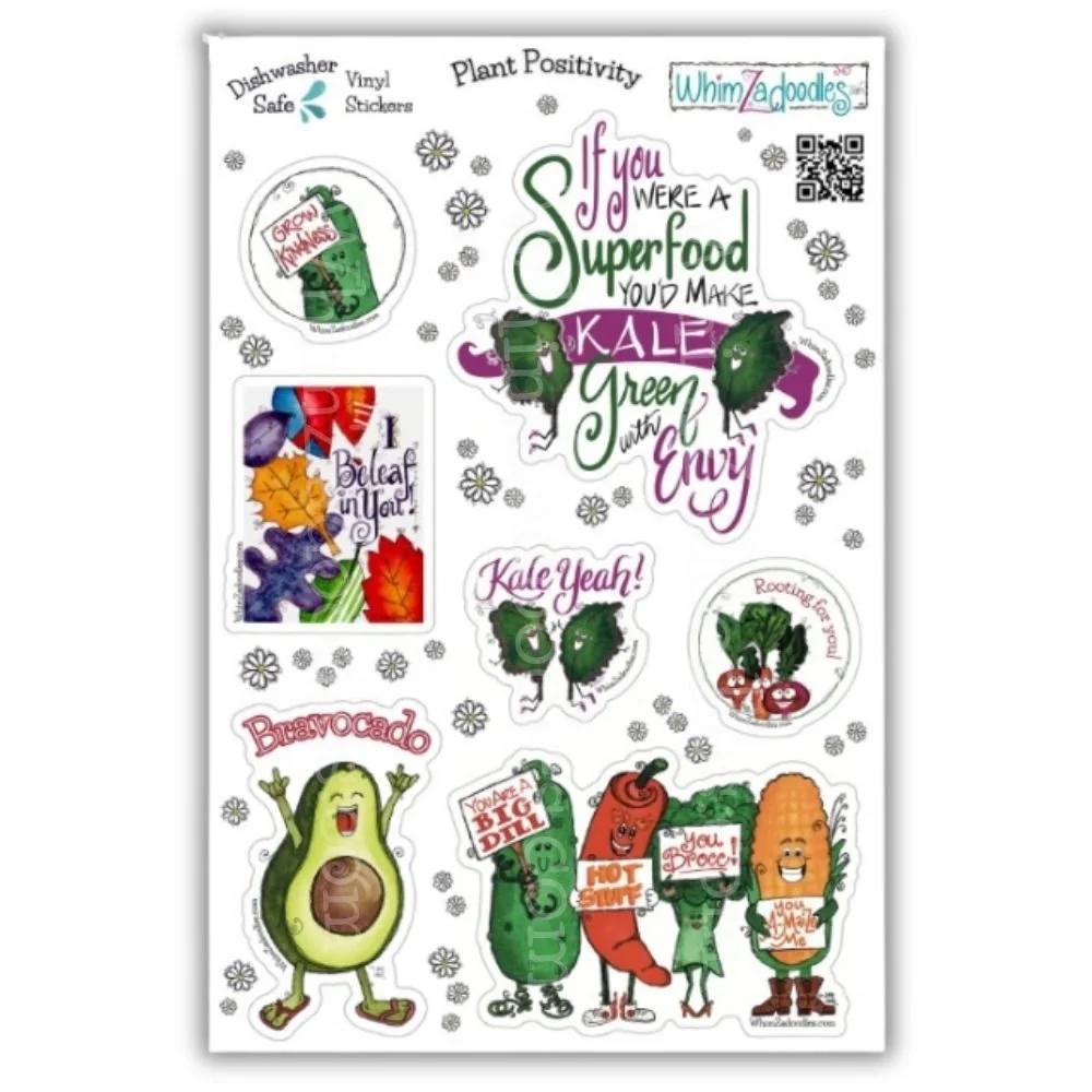 Hand holding the Plant Positivity watercolor sticker sheet featuring colorful vegetable characters and positive sayings to show sticker size and detail.