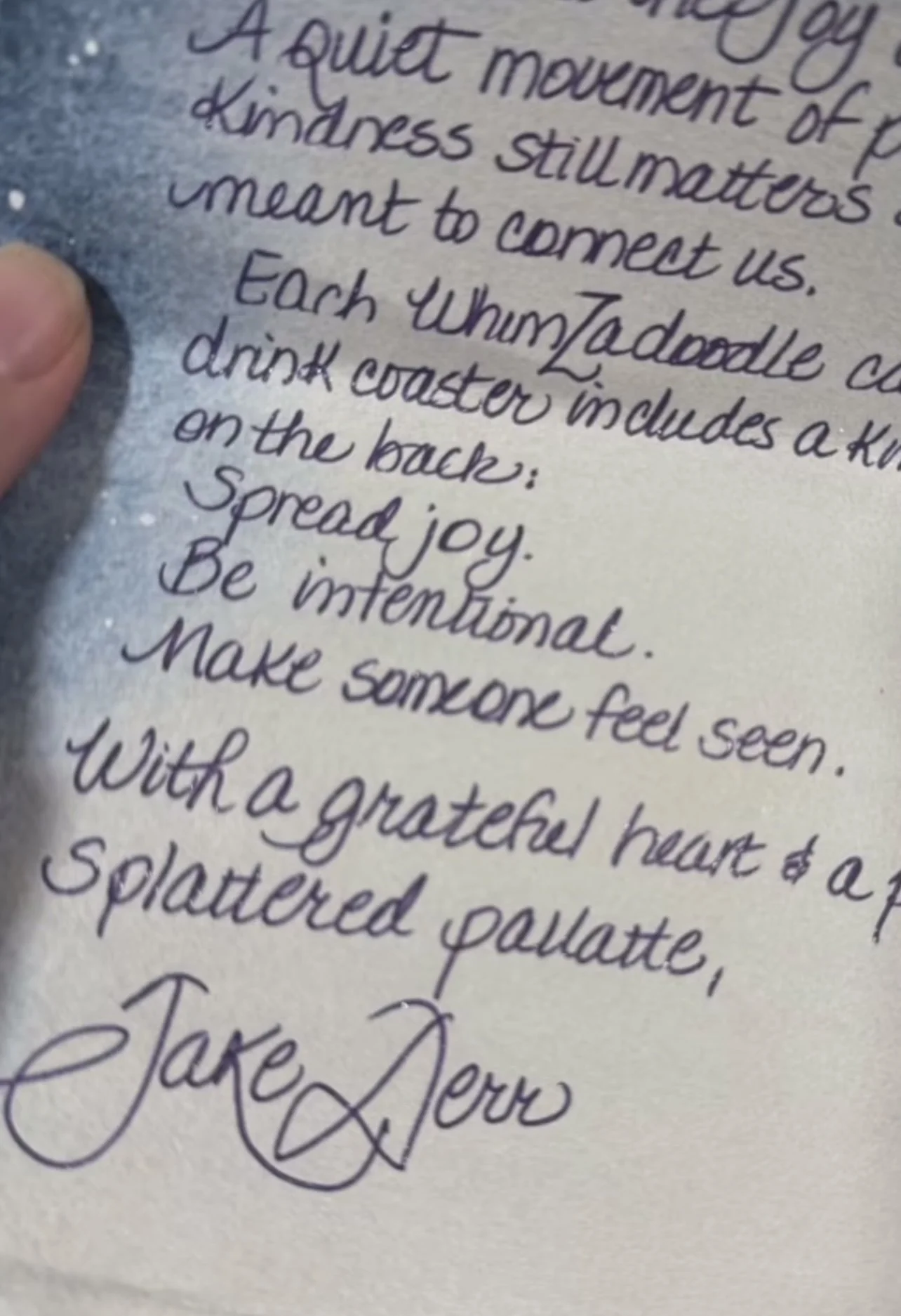 Close-up of a handwritten note from WhimZadoodles with a message about spreading joy, kindness, and making others feel seen.