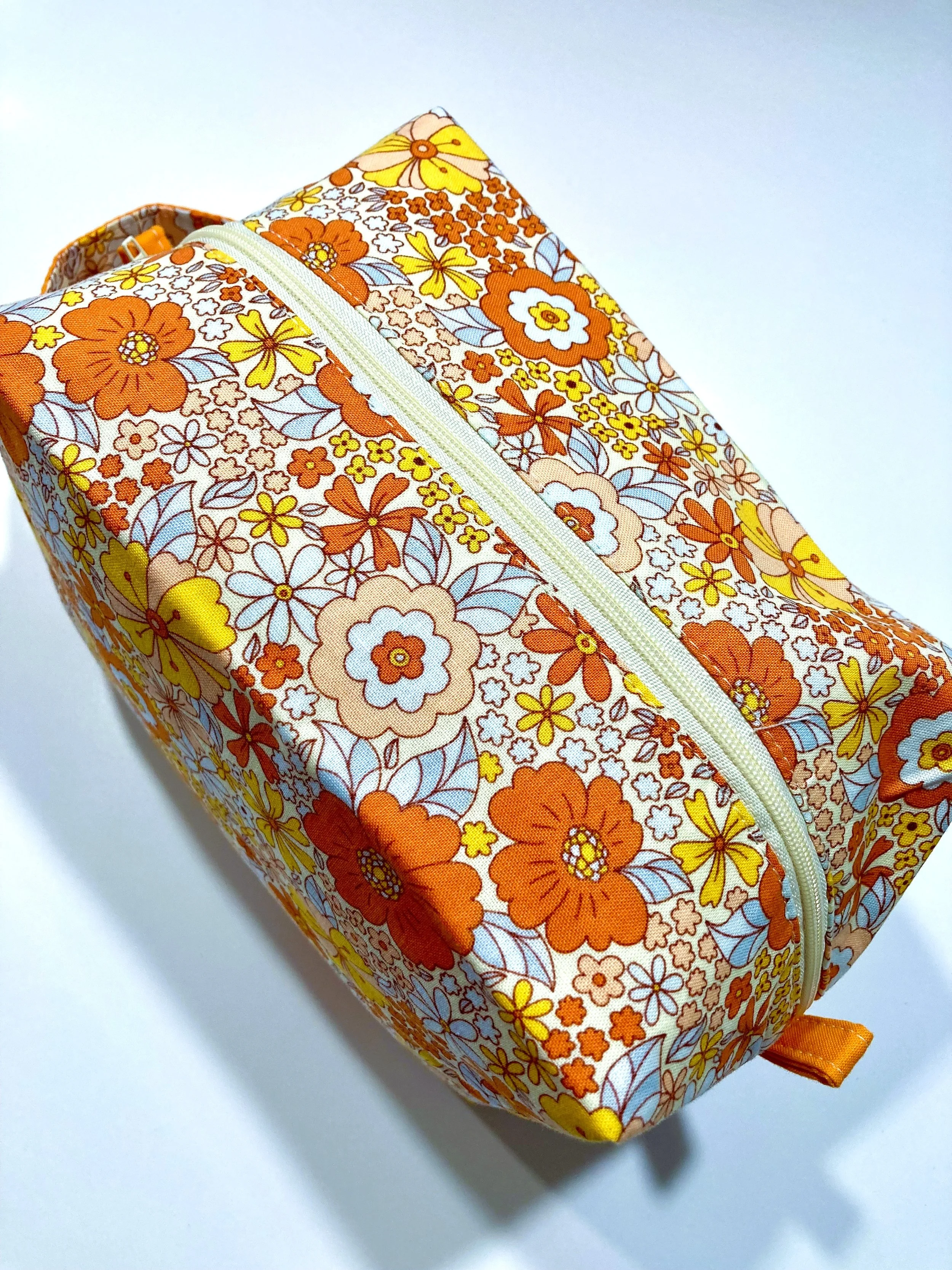 Retro 70s Orange Floral Travel Cosmetic Bag Hippie Flower Power Boho Makeup Case Top View.jpeg