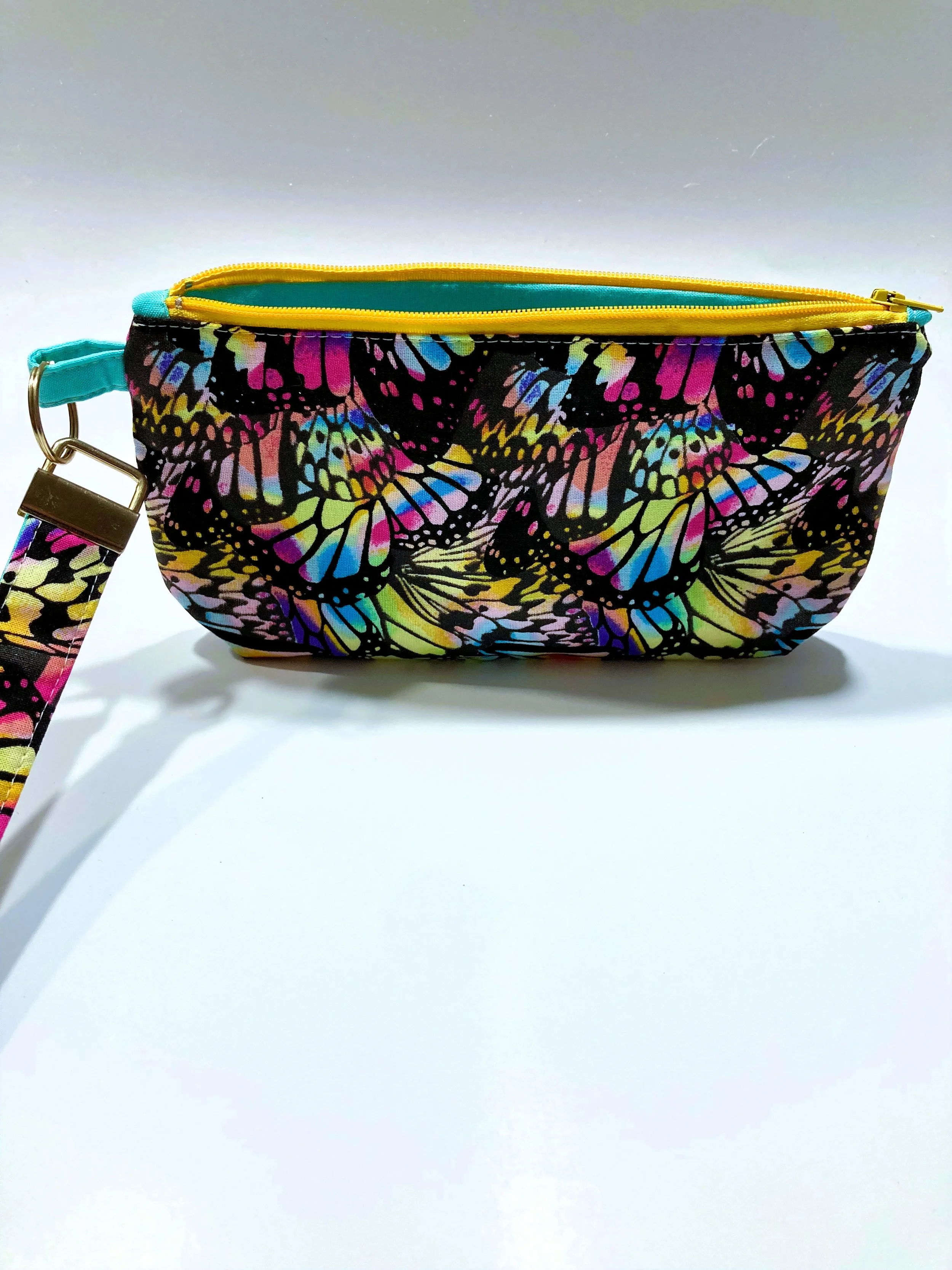 Rainbow Butterfly Wing Zip Wristlet Vivid Neon Multicolor Cosmetic Bag Front View A.jpeg