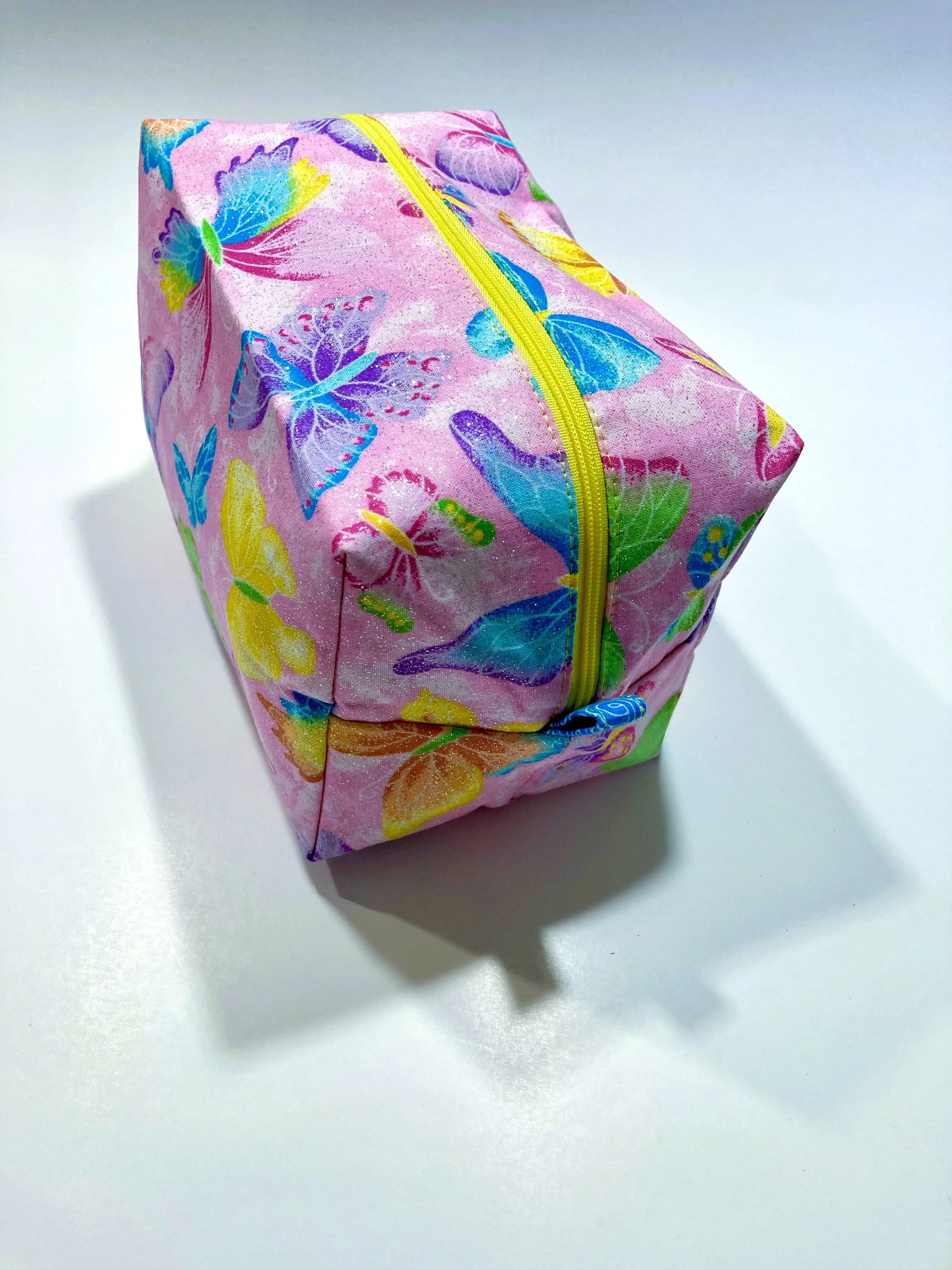 Shimmer Pink Butterfly Cosmetic and Travel Bag Vibrant Makeup Case Handle Side Angle View A.jpeg