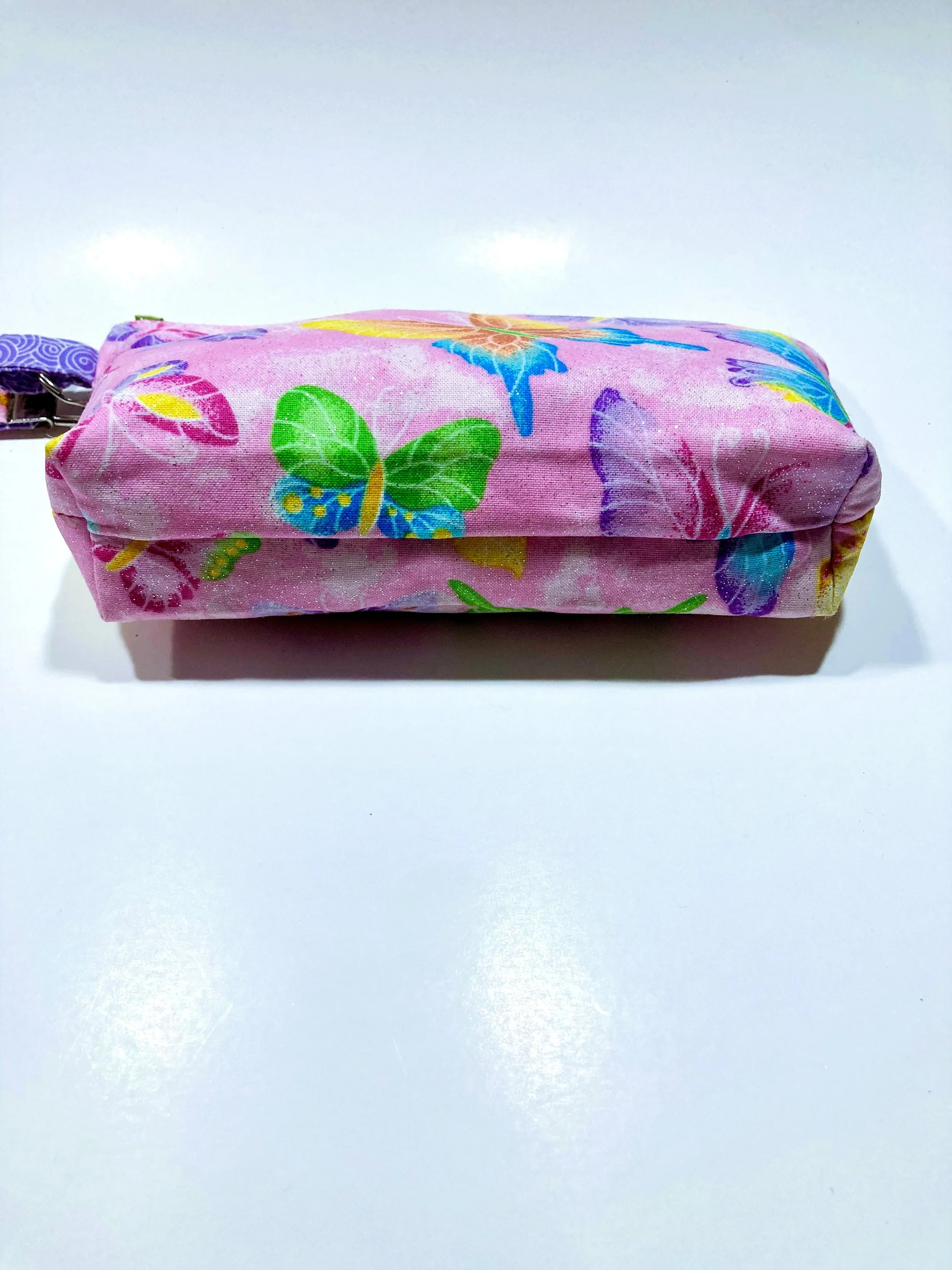 Shimmer Pink Butterfly Zip Wristlet Vibrant Cosmetic Bag Bottom View.jpeg