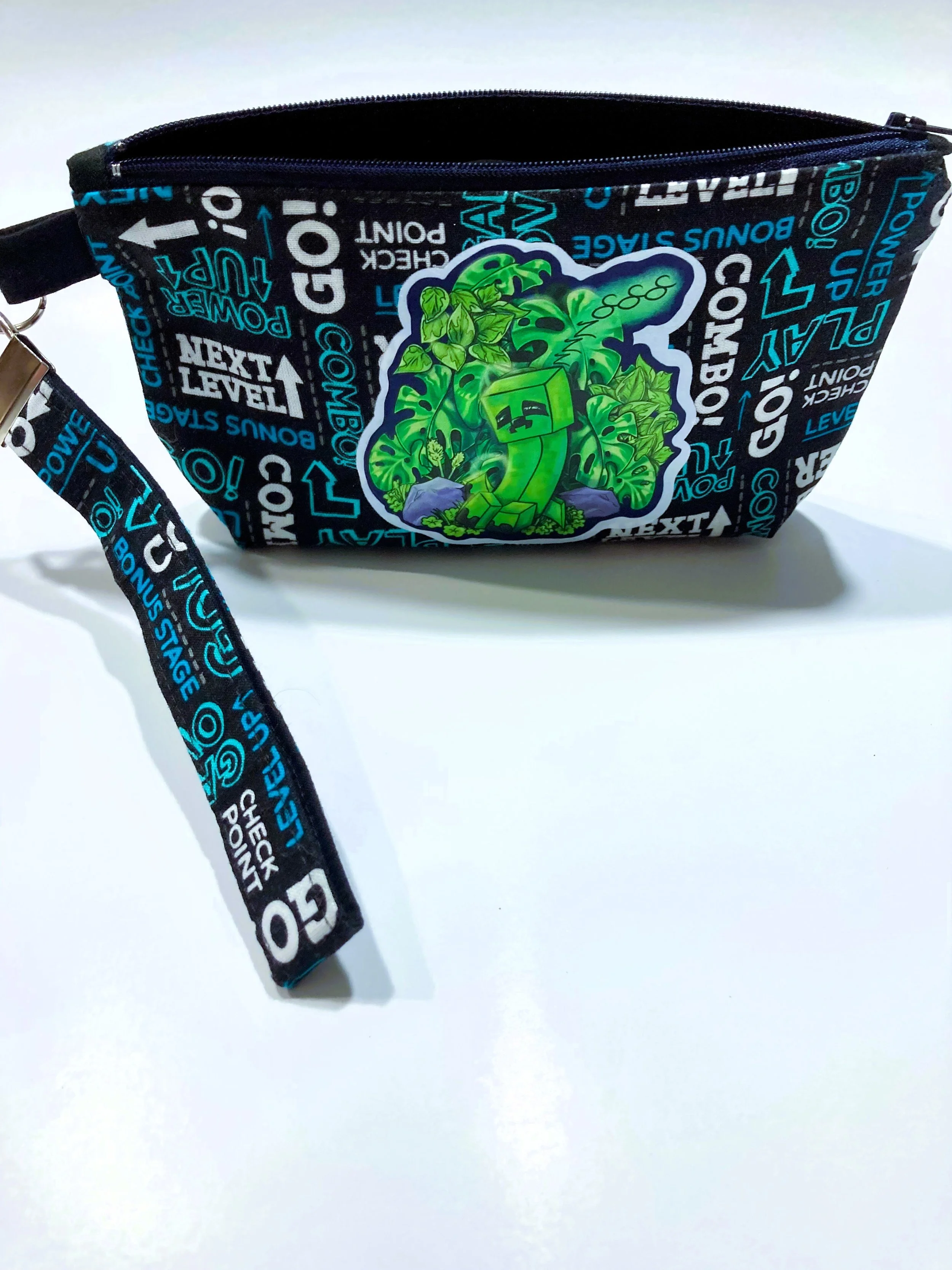 Game Over Zip Wristlet Green Pixel Monster Fan Art Gaming Cosmetic Bag Front View.jpeg