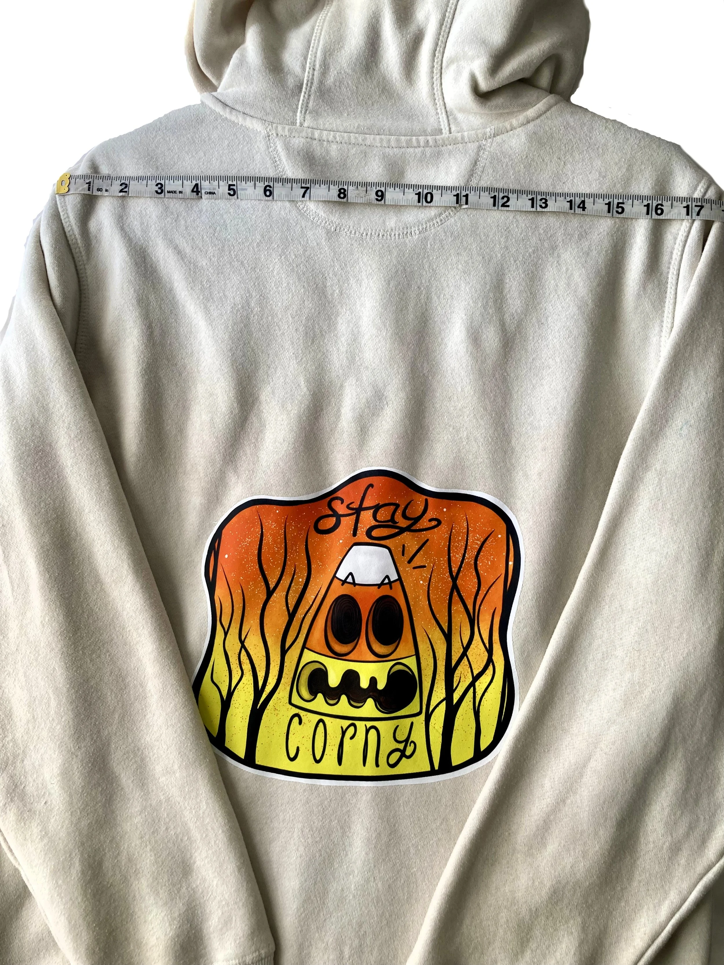 Upcycled Reworked Bone White Candy Corn Zip Hoodie Custom Halloween Artwork Demension Across Shoulders.jpeg