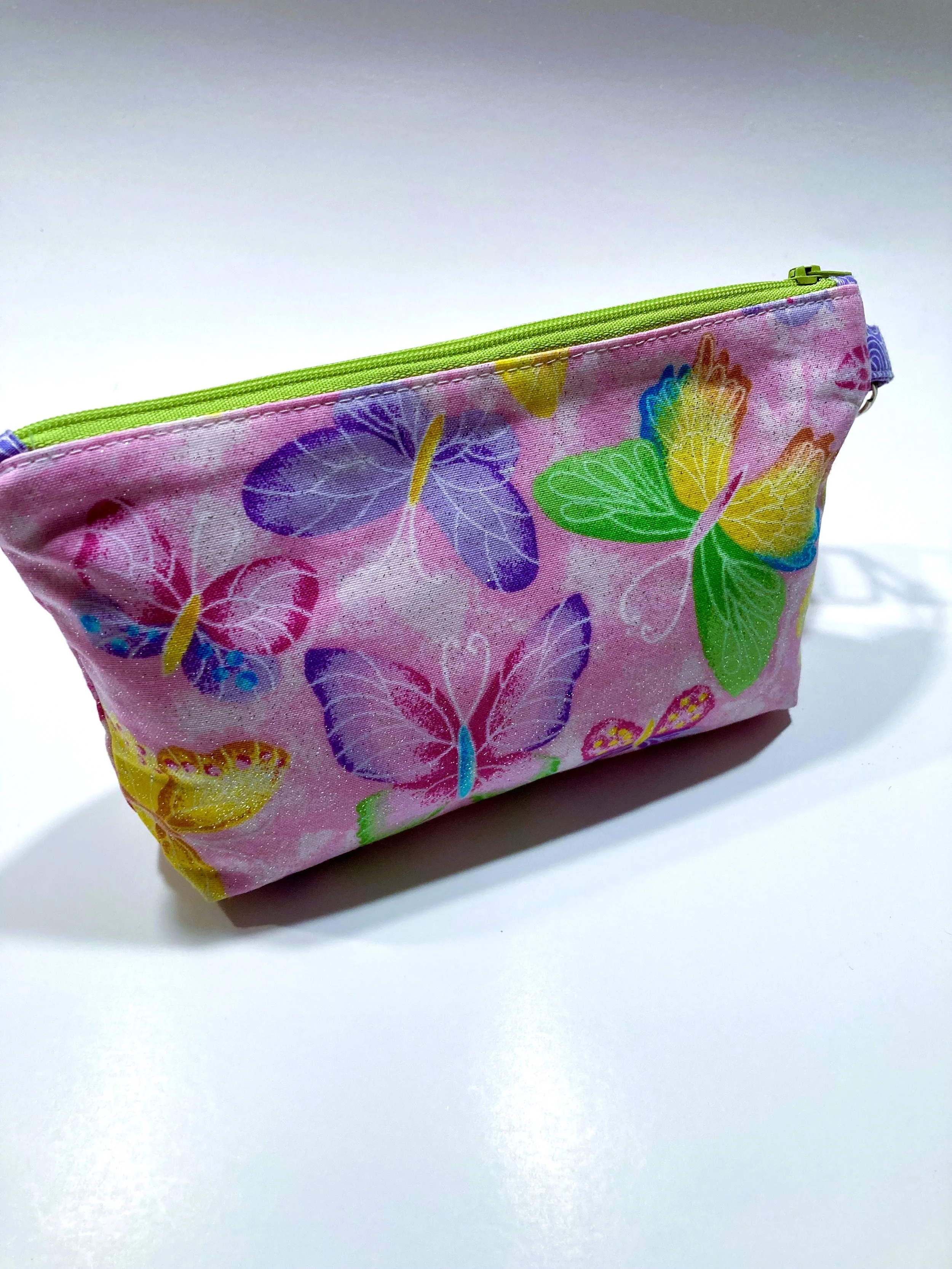 Shimmer Pink Butterfly Zip Wristlet Vibrant Cosmetic Bag Back View.jpeg
