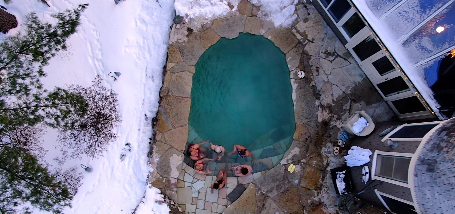 Friends enjoying the plunge pool 9 - girls toasting from above.jpg