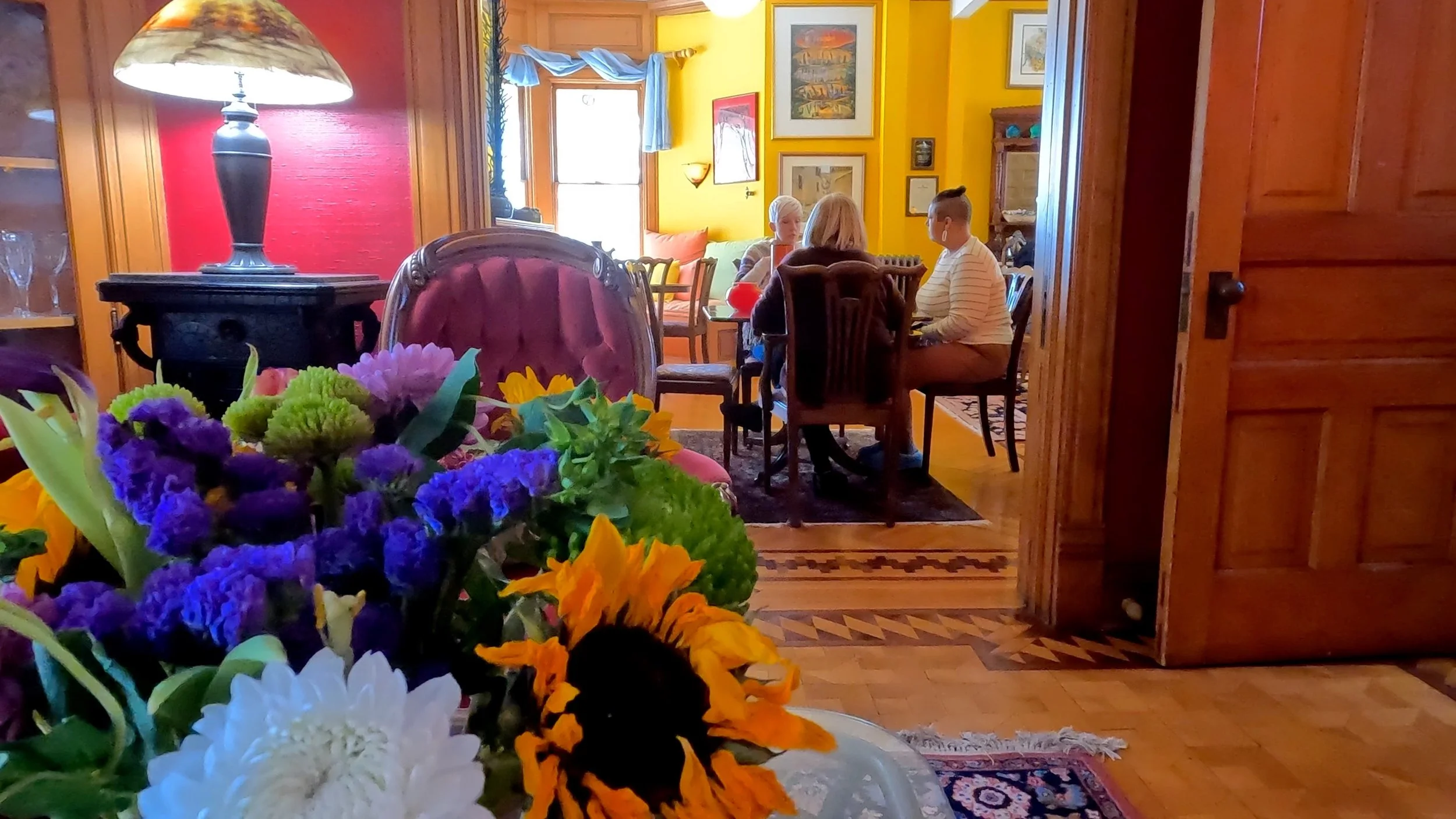 Friends enjoying a meal - flowers in foreground.jpg