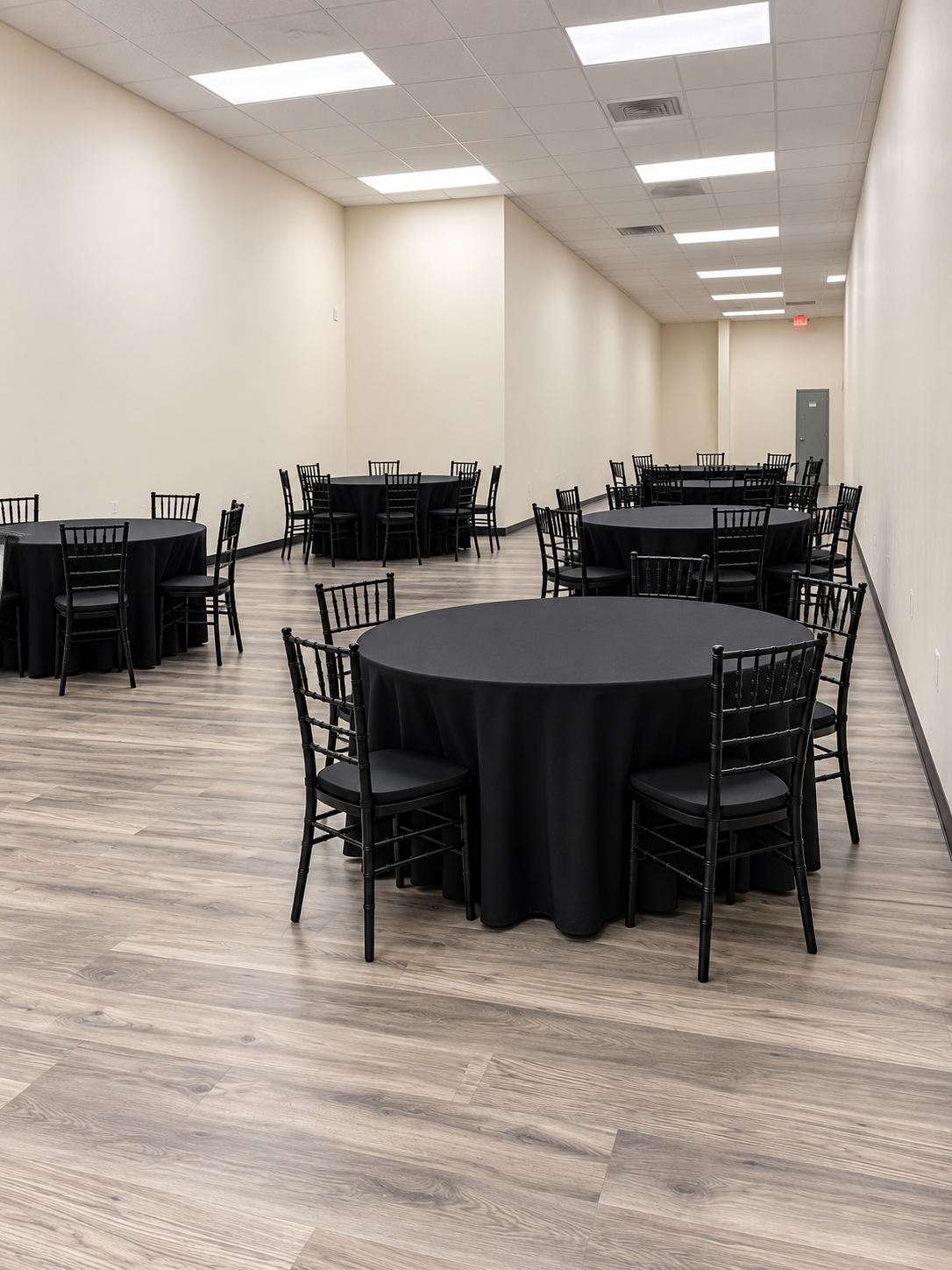 Modern Banquet Hall with Black Tables (1).png