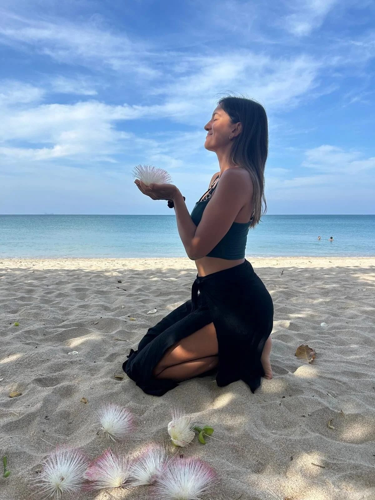 Highlight of the day:
This morning, beautiful flowers fell down around us.
Unexpected. Unplanned. From the unknown.

Sitting in the sand, breathing in their magnificent scent, looking out over the horizon.
A quiet moment of safety, presence, and grat