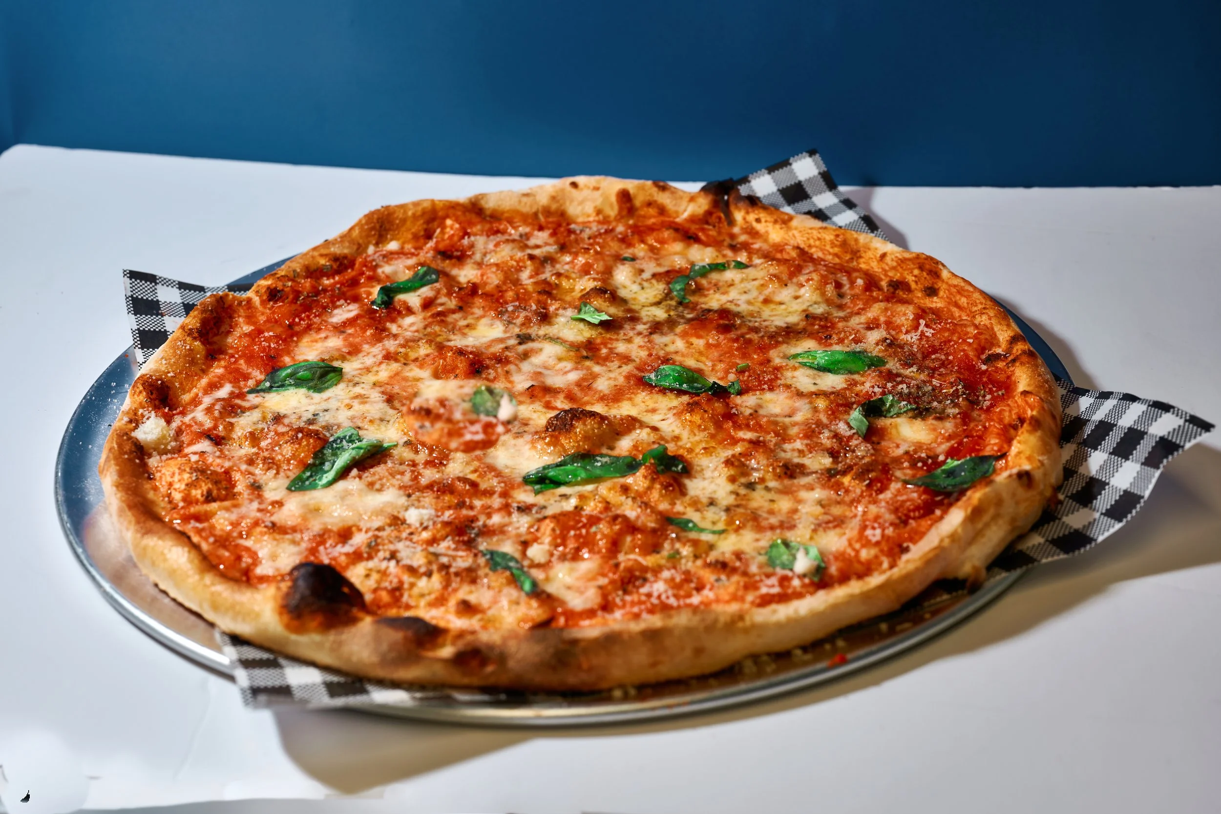 Vinny's Margherita with tomato sauce, fresh and aged mozzarella, grana padano, oregano, fresh basil