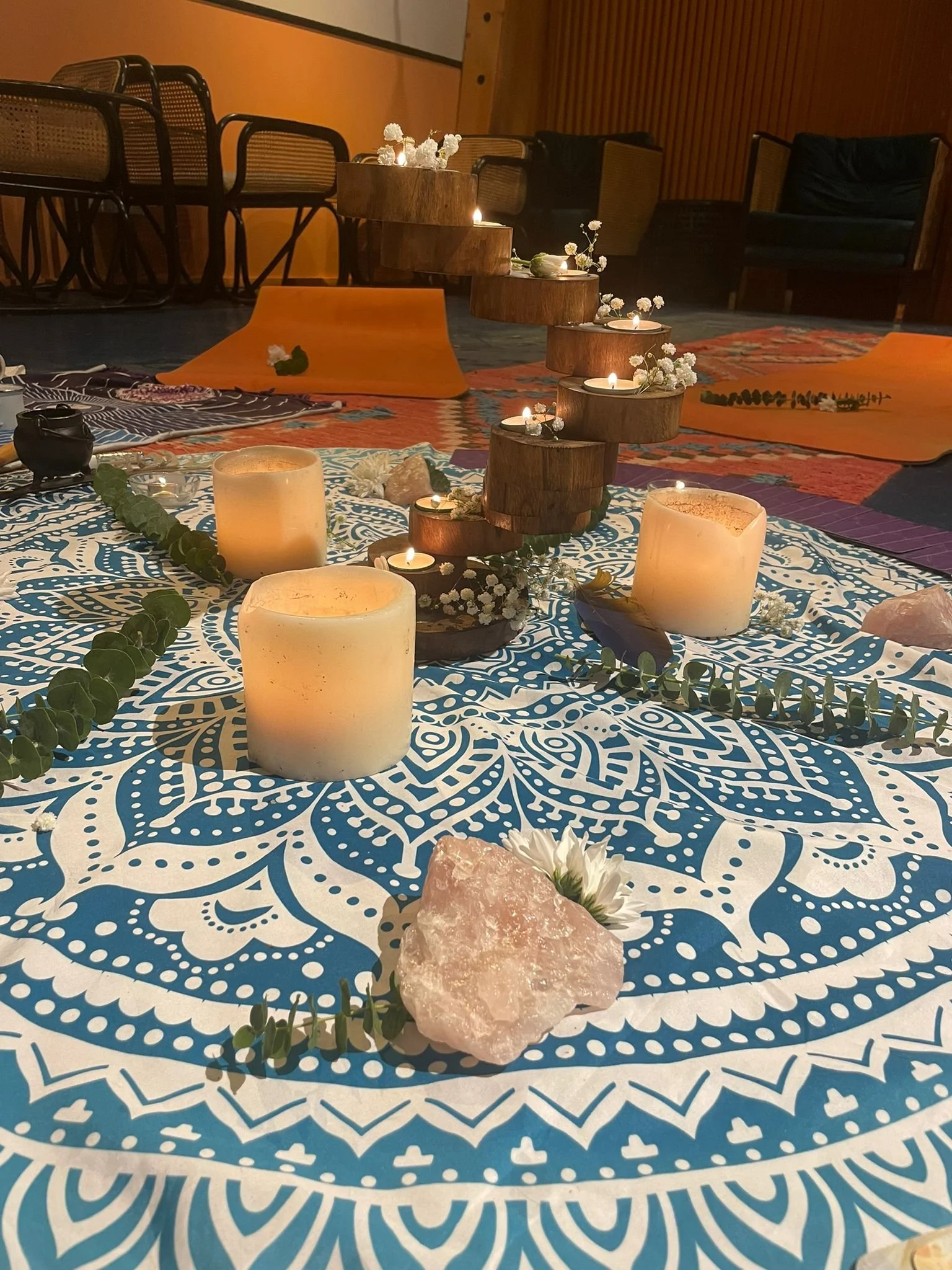 Crystals, flowers, candles and incense all part of the sacred offerings