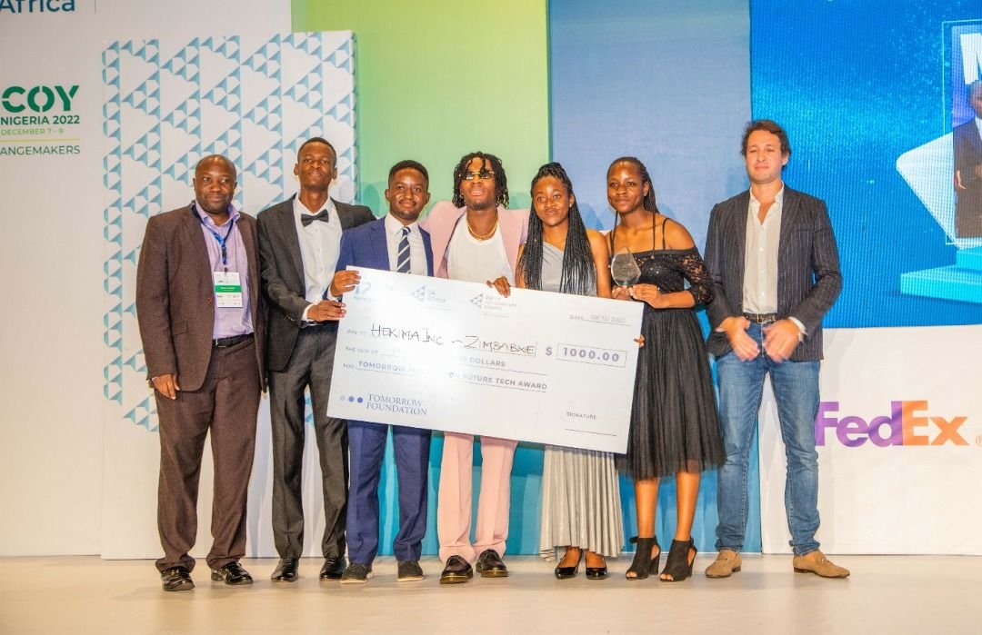 Accepting the Tomorrow Foundation Future Tech Award with Joeboy at the JA Africa COY 2022.