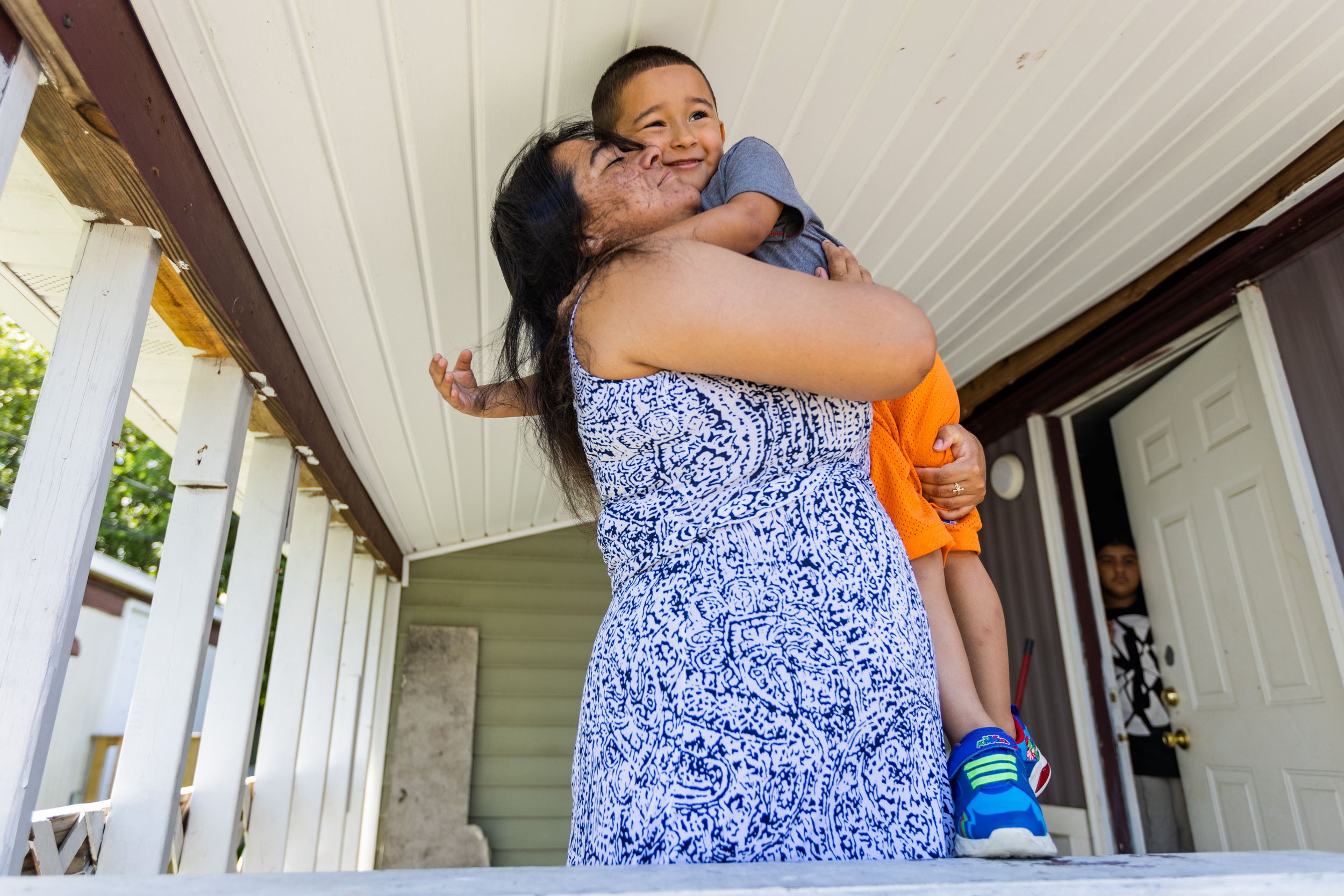  Mirna Yamileth Valladares Flores holds son Ruber Aviel Ortez Valladares, 4, for a portrait at her home in Norfolk, Virginia on Saturday, July 29, 2023. Valladares speaks English “less than very well,” which has created difficulties getting services 