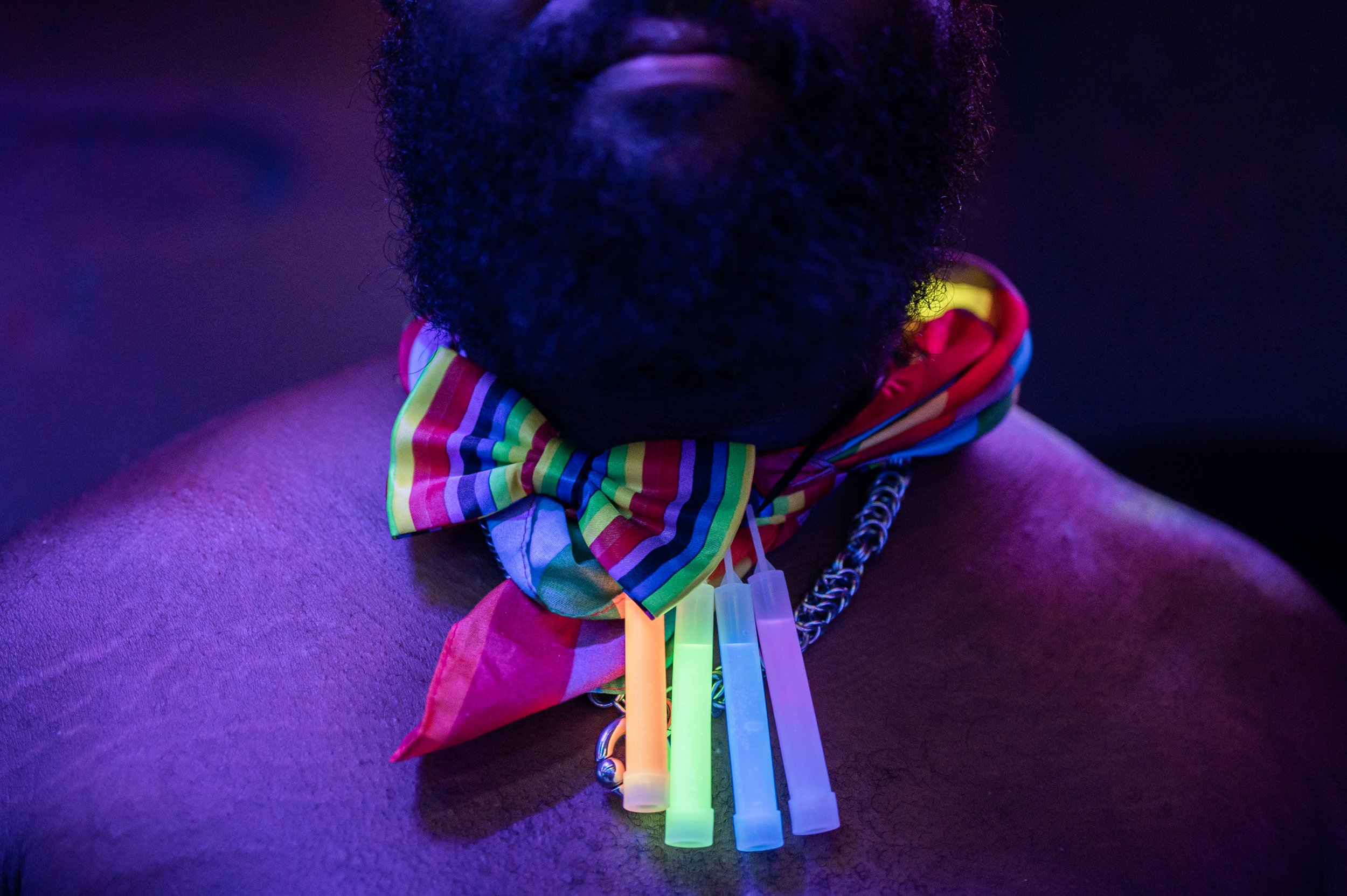  Moe Hayward poses with accessories during a Neon Bear Glow Party at MJ’s Tavern in Norfolk, Va. on Saturday, June 17, 2023. The Virginia Bear Contest auctioned off a crocheted bear at the Glow Party, with all proceeds donated to the LGBT Life Center