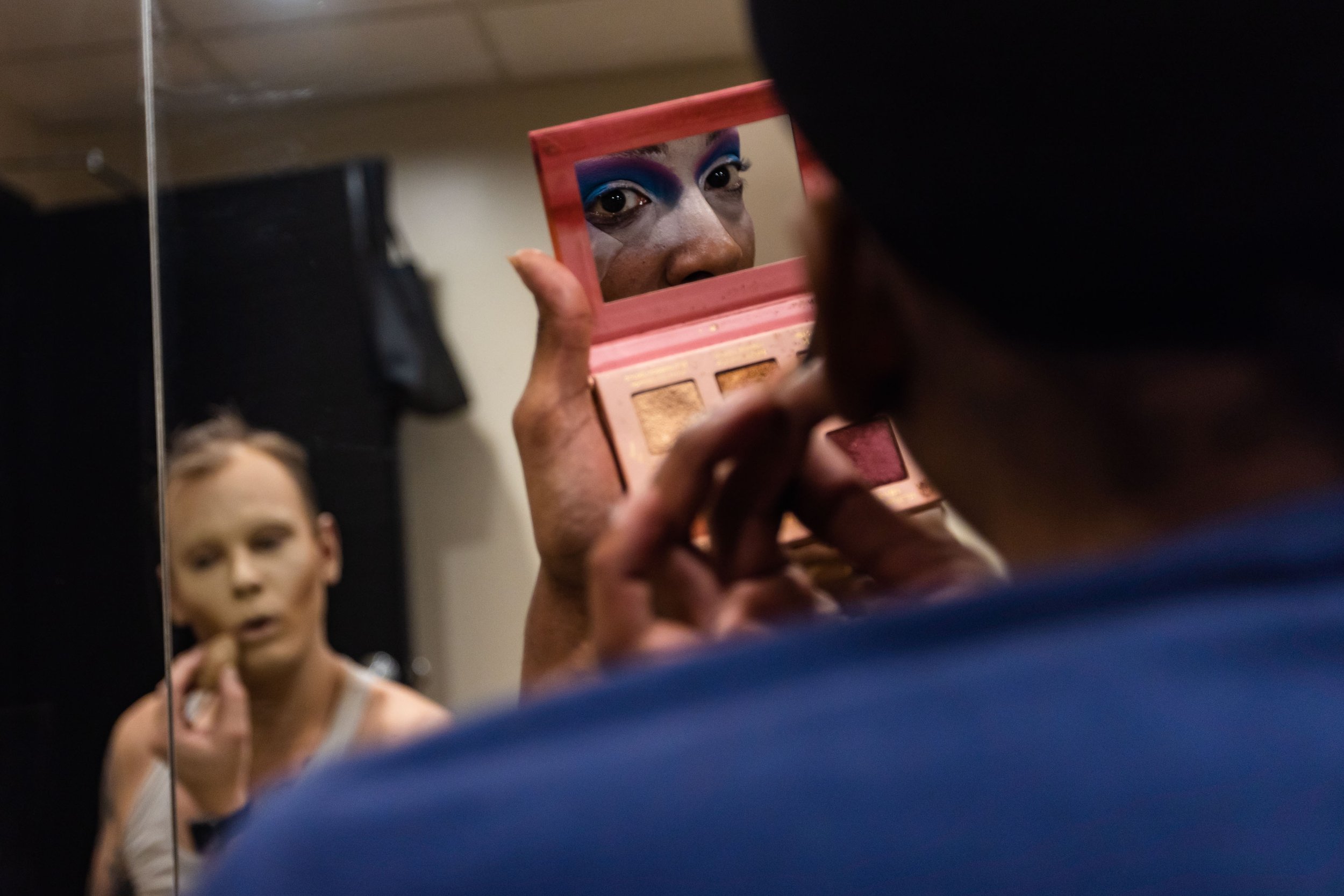  Hampton Roads drag queen Lola Monroe, right, applies makeup in a dressing room with drag queen Gillette Belladonna before performing at NorVa's Studio 54 PrideFest Block Party in Norfolk, Va. on Friday, June 23, 2023. (Tess Crowley / The Virginian-P