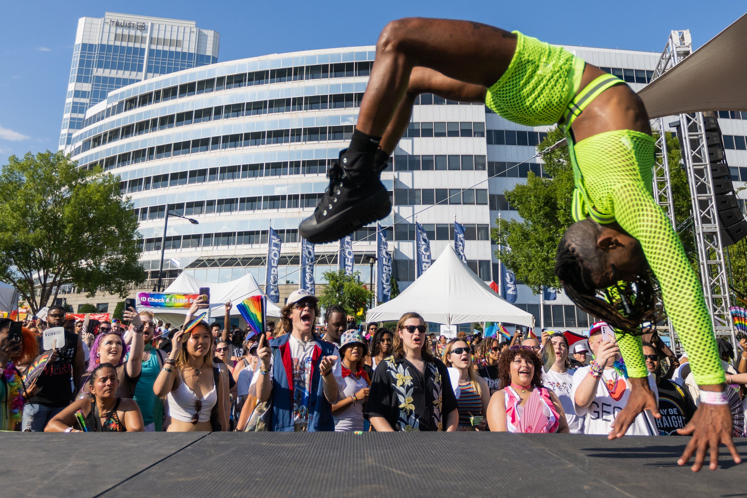  A background dancer for drag queen Mo Heart performs a flip on the mainstage at Hampton Roads PrideFest at Town Point Park in Norfolk, Va. on Saturday, June 24, 2023. (Tess Crowley / The Virginian-Pilot) 