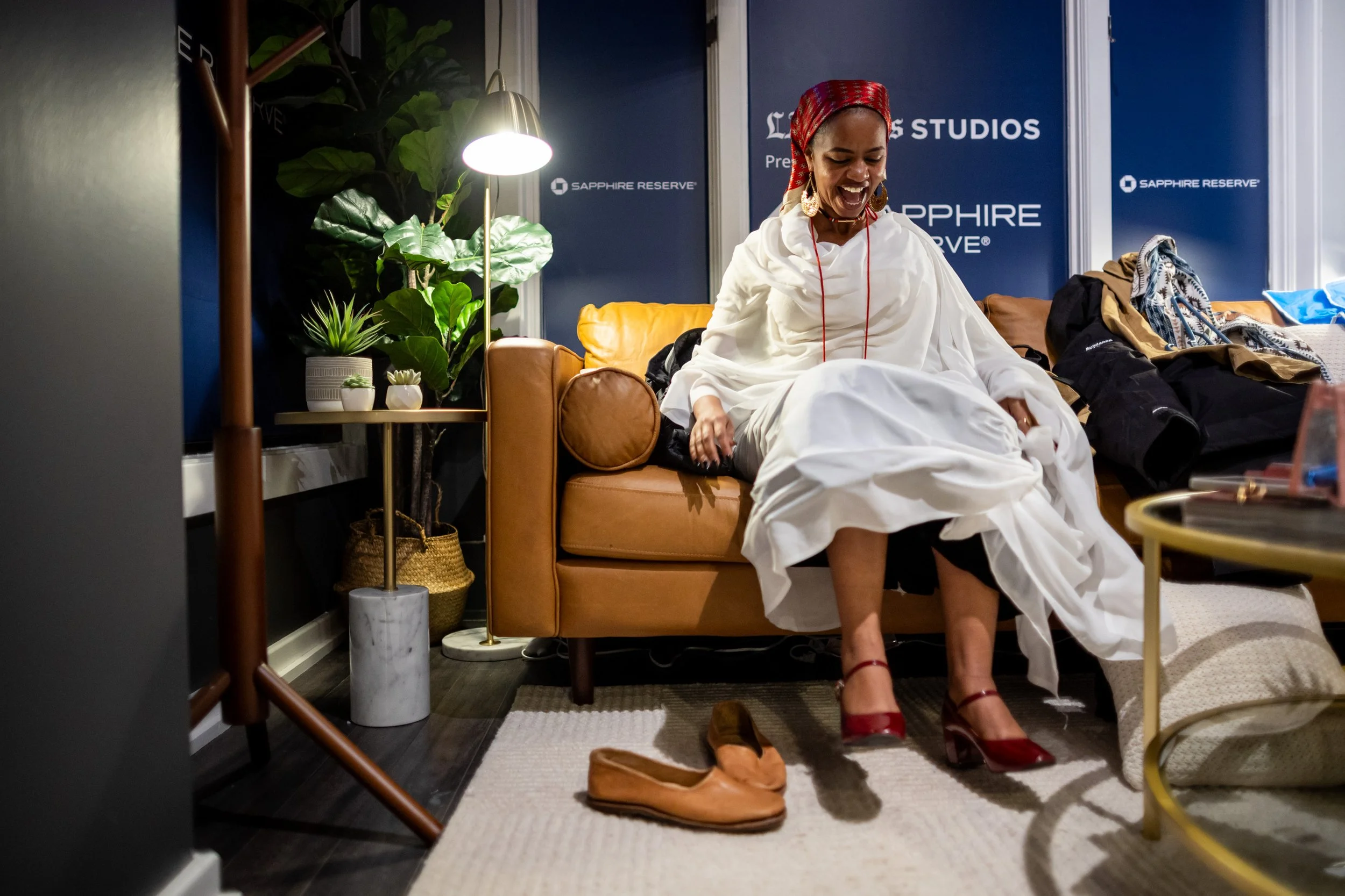  “Khartoum” director Rawia Alhag puts on a thobe, a traditional Sudanese garment worn by women, for a photo shoot at the L.A. Times Studio in Park City on Sunday, Jan. 26, 2025. The four Sudanese directors traveled for 24 hours from Nairobi, Kenya, t