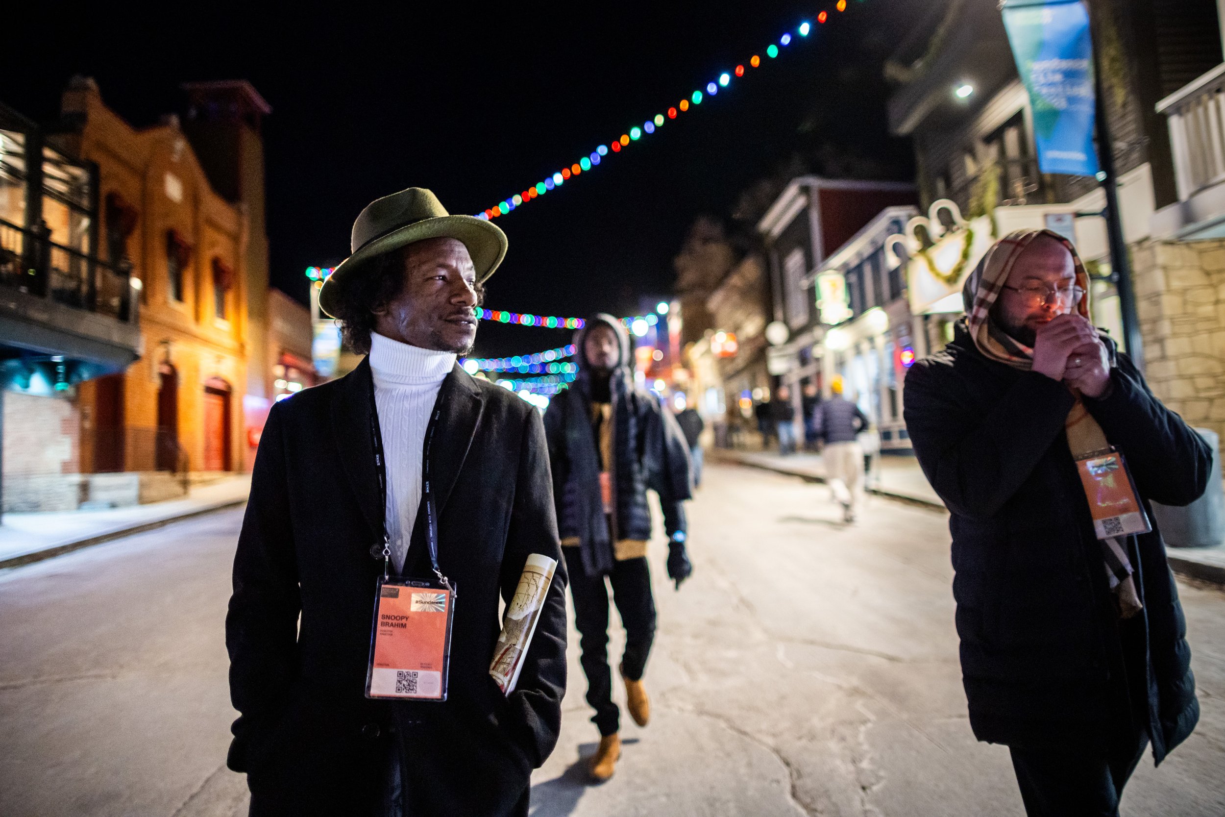  “Khartoum” Sudanese directors Ibrahim Snoopy, left, Timeea Mohamed Ahmed, center, and “Khartoum” editor Yousef Jubeh, right, leave after a night of parties on Main Street in Park City on Thursday, Jan. 23, 2025. The four Sudanese directors traveled 