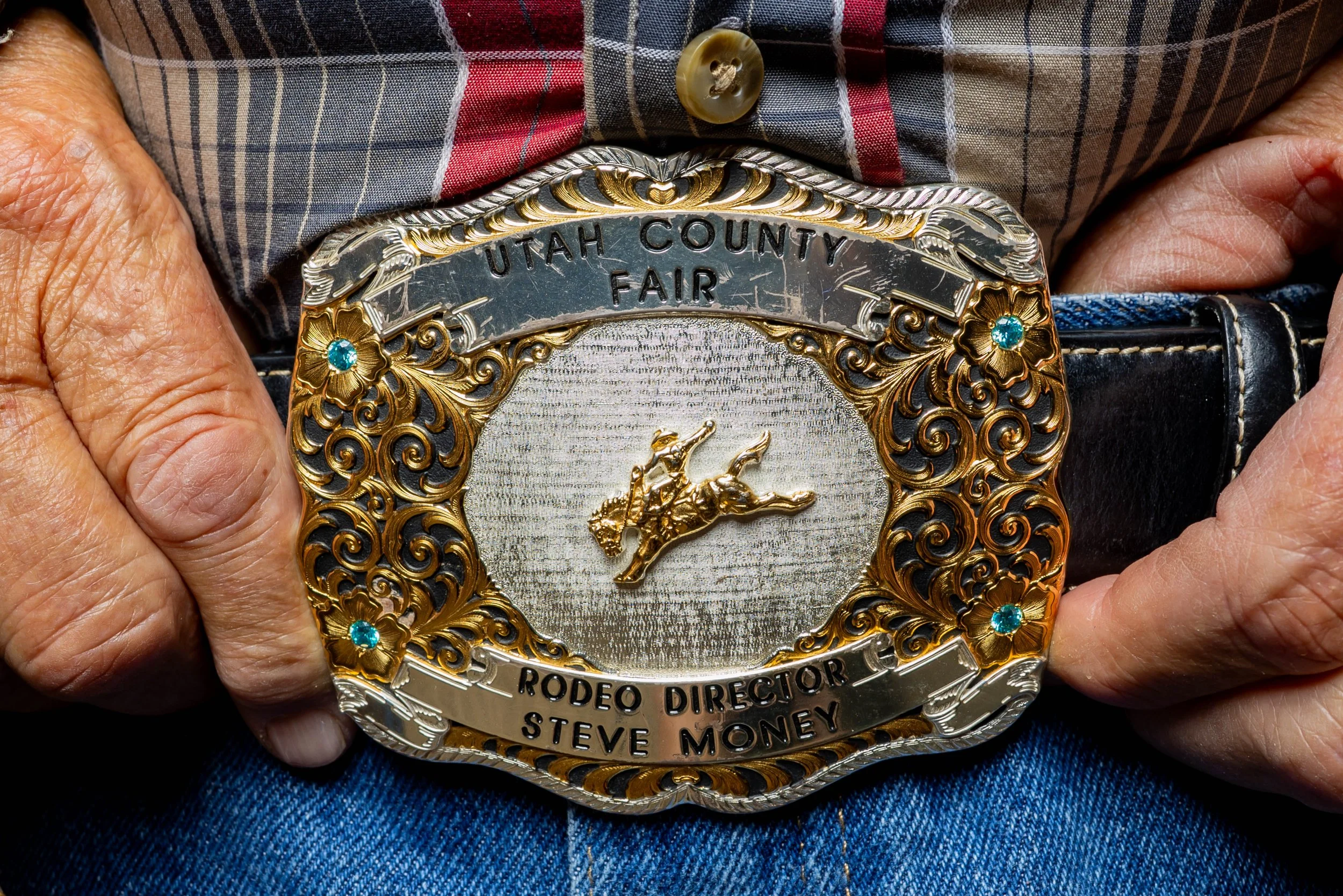  Utah County Fair Rodeo Director Steven Money shows off his belt buckle at his home in Spanish Fork on Monday, July 28, 2025, before the upcoming Utah County Fair. 