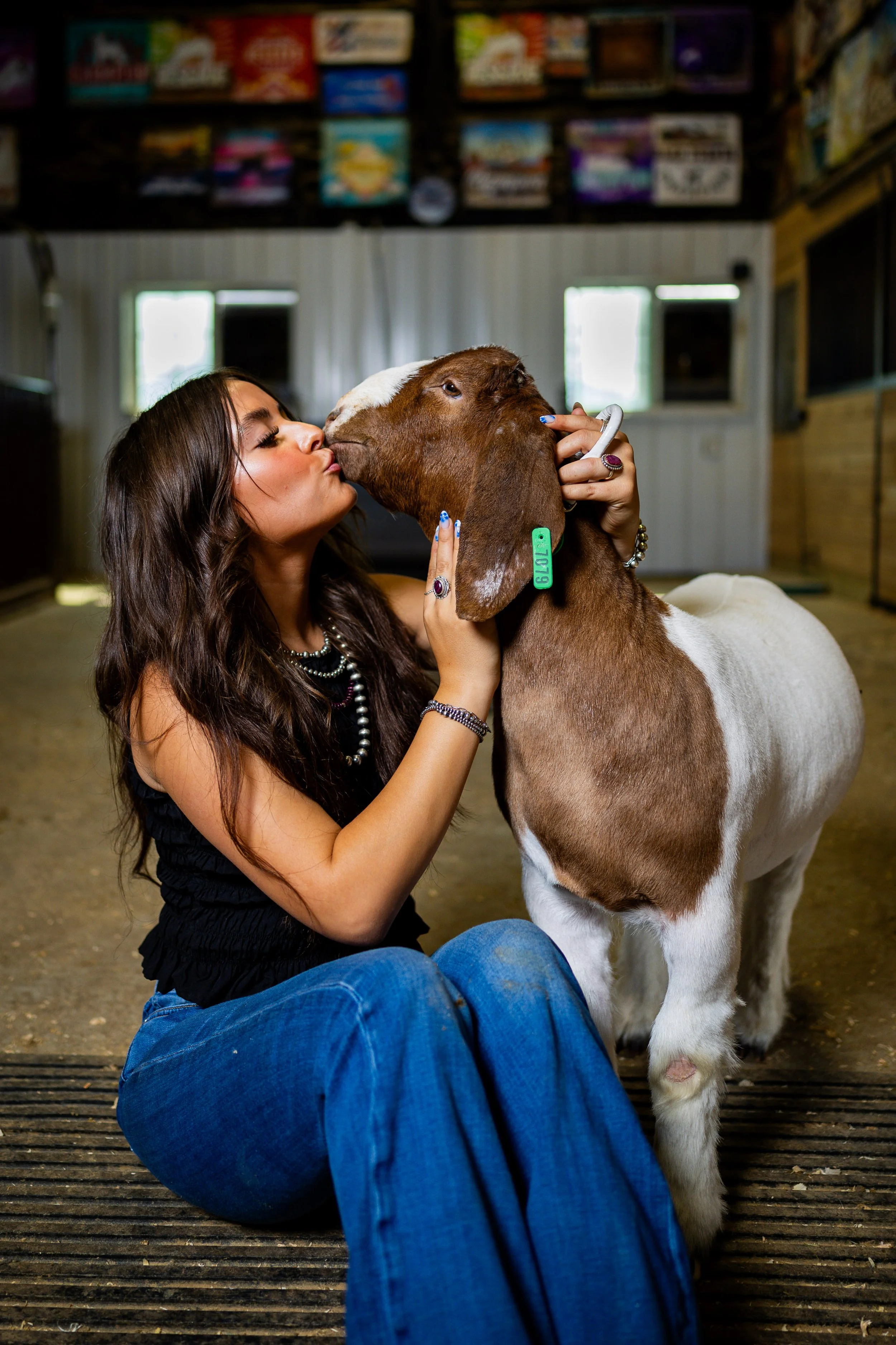  Taygan Johnson, 17, poses with her goat Biggi in her barn in Benjamin on Friday, July 25, 2025, before showing Biggi in the market show at the upcoming Utah County Fair. Johnson won Grand Champion Senior Showman and 4th Overall Heavyweight Lamb at t