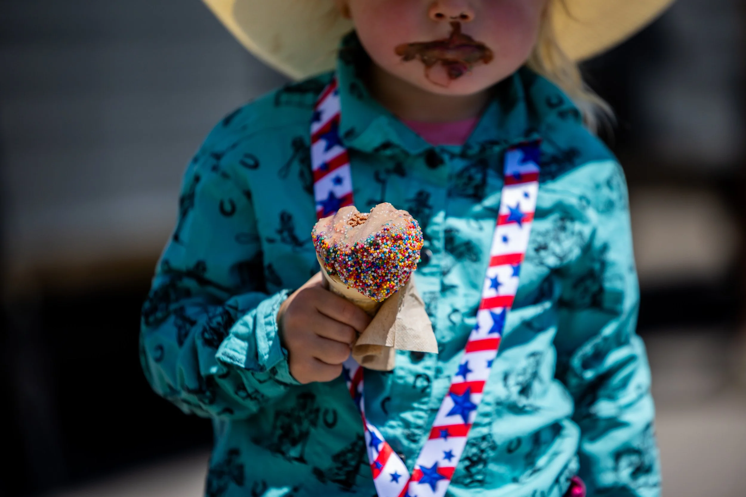  Raelynn Hall, 2, from Spanish Fork, eats ice cream at the Utah County Fair in Spanish Fork on Saturday, August 2, 2025.  