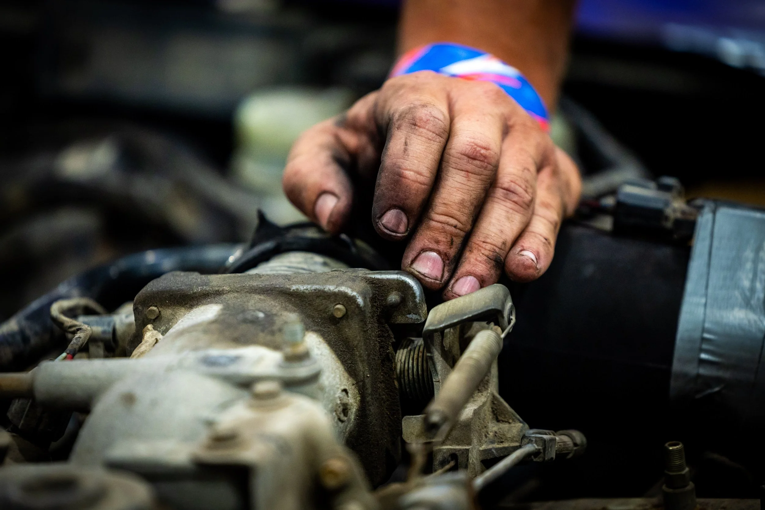  Travis Jones helps fix his son Milo Jones’, 13, car during driver check-in before the Demolition Derby at the Utah County Fair in Spanish Fork on Saturday, August 2, 2025.  