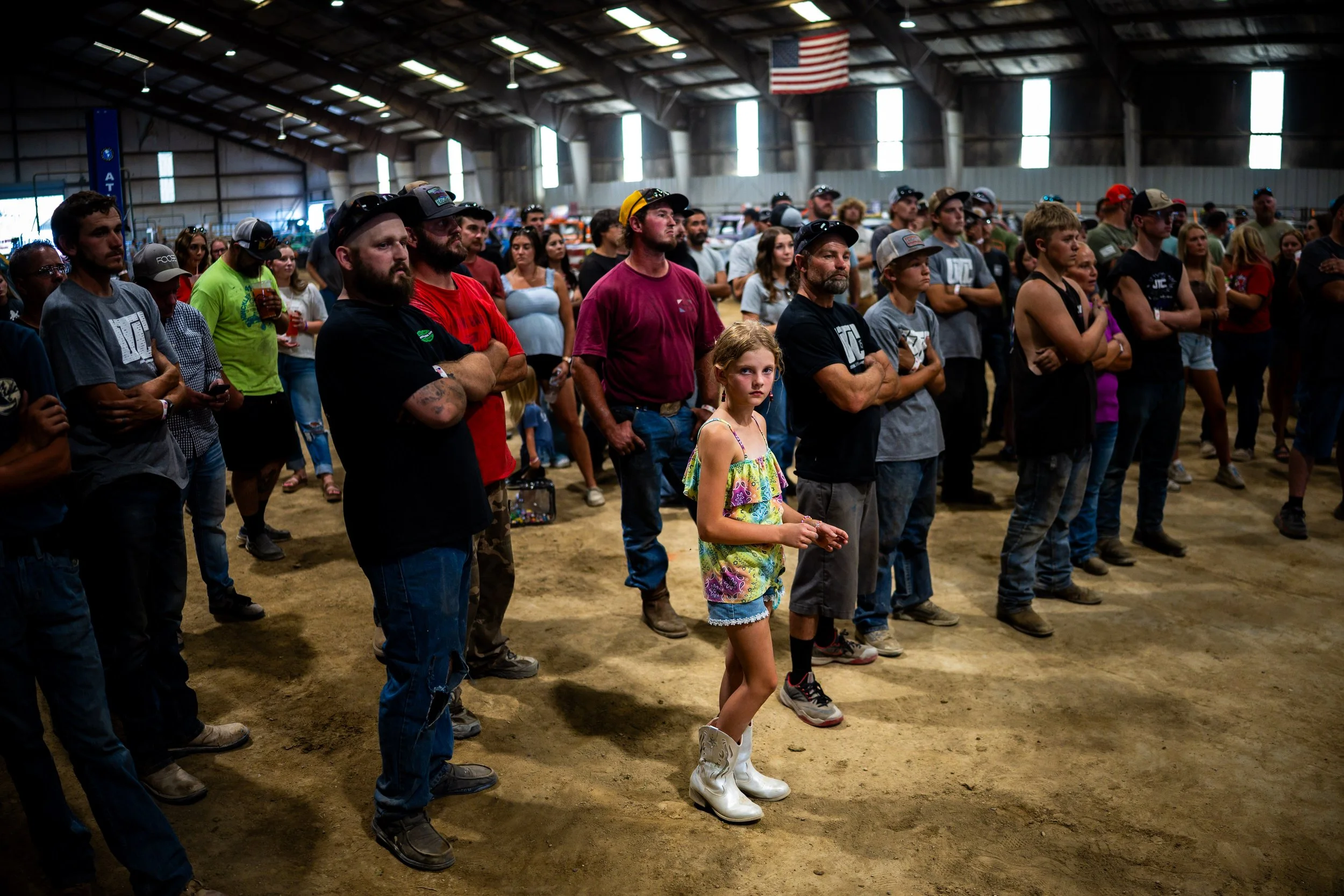  Tinsley Heinz, 9, from Mapleton, center, listens during driver check-in before the Demolition Derby at the Utah County Fair in Spanish Fork on Saturday, August 2, 2025.   