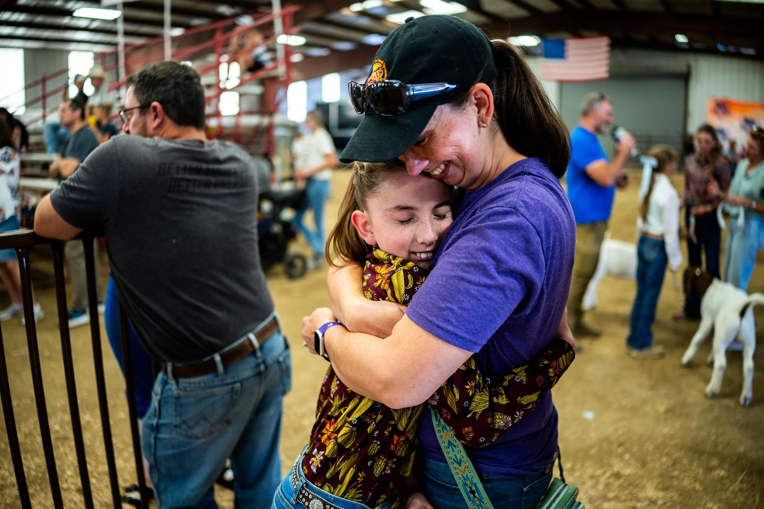  Julia Hanson, 11, from Eagle Mountain, left, hugs her mom Cathryn Hanson, right, after winning 4th place in the Junior Goat Showmanship at the Utah County Fair in Spanish Fork on Friday, August 1, 2025. 