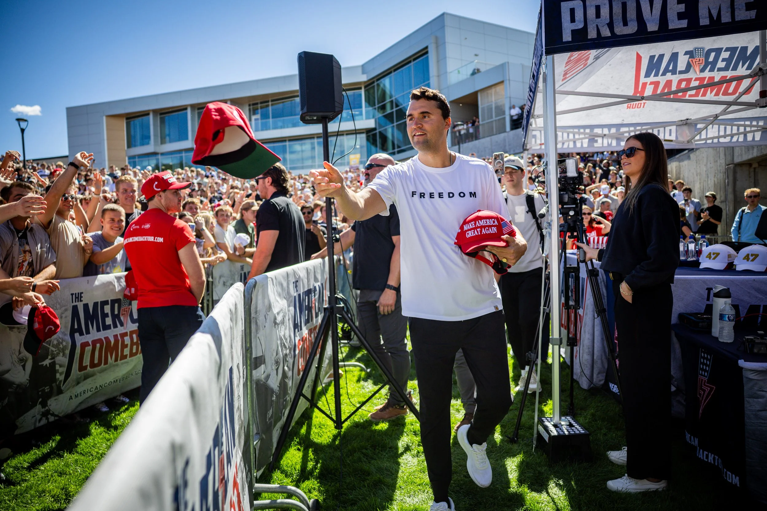  Charlie Kirk, the CEO and co-founder of the conservative youth organization Turning Point USA, hands out hats before he is fatally shot during Turning Point’s visit to Utah Valley University in Orem on Wednesday, Sept. 10, 2025. (Tess Crowley/Desere