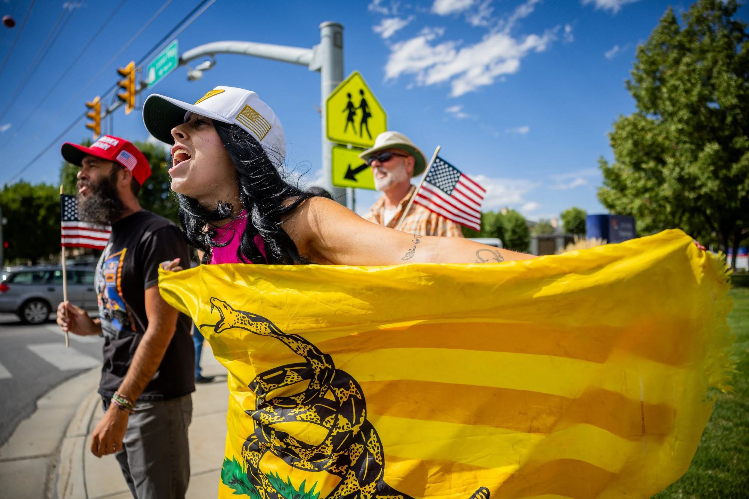  Cynthia H., center, yells toward a car that yelled out a negative comment about Charlie Kirk outside the Timpanogos Regional Hospital after Charlie Kirk, the CEO and co-founder of the conservative youth organization Turning Point USA, died at the ho