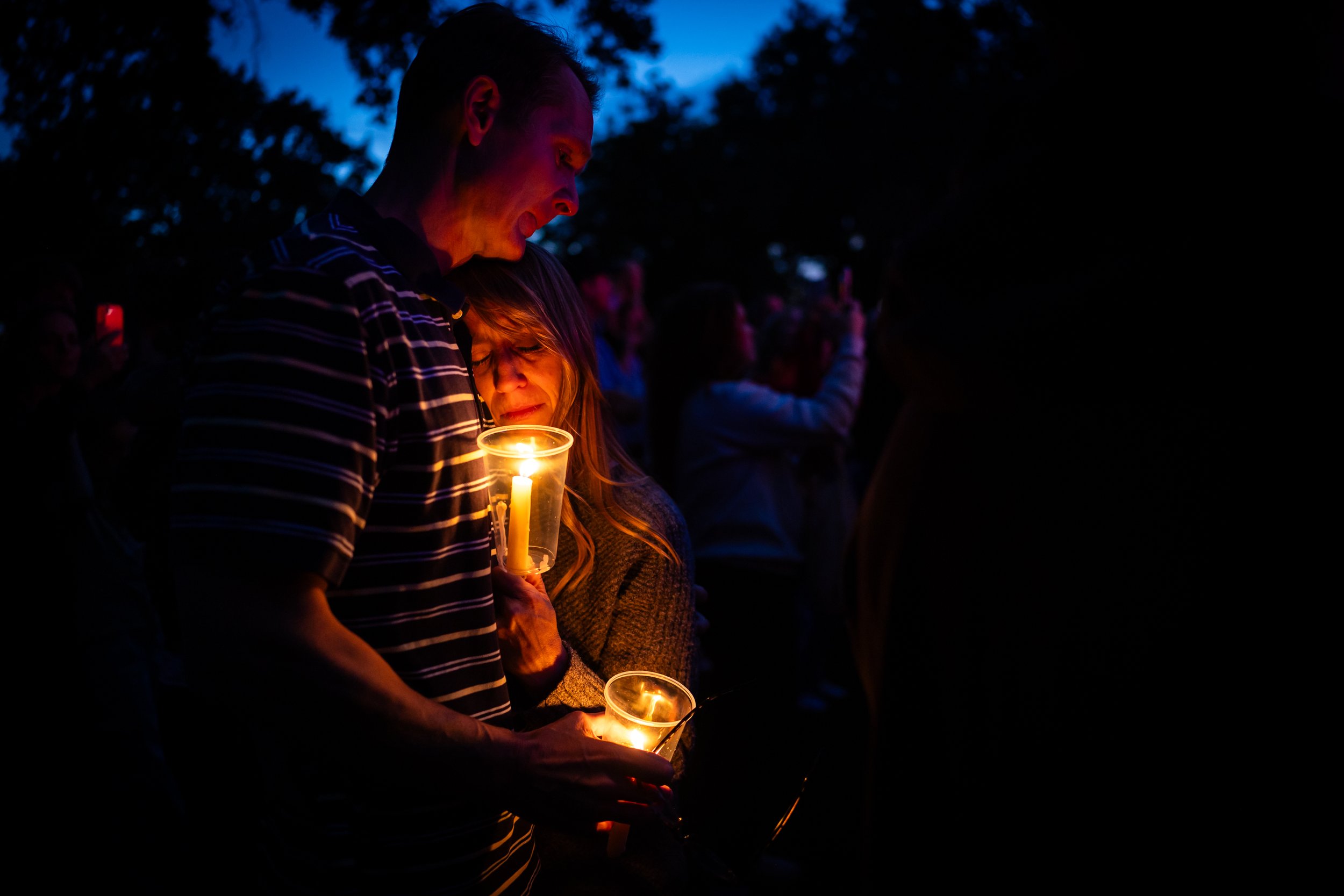  Rachel Terry, center, and husband Ben Terry, left, grieve at a vigil for Charlie Kirk, the CEO and co-founder of the conservative youth organization Turning Point USA, who was fatally shot during Turning Point’s visit to Utah Valley University in Or