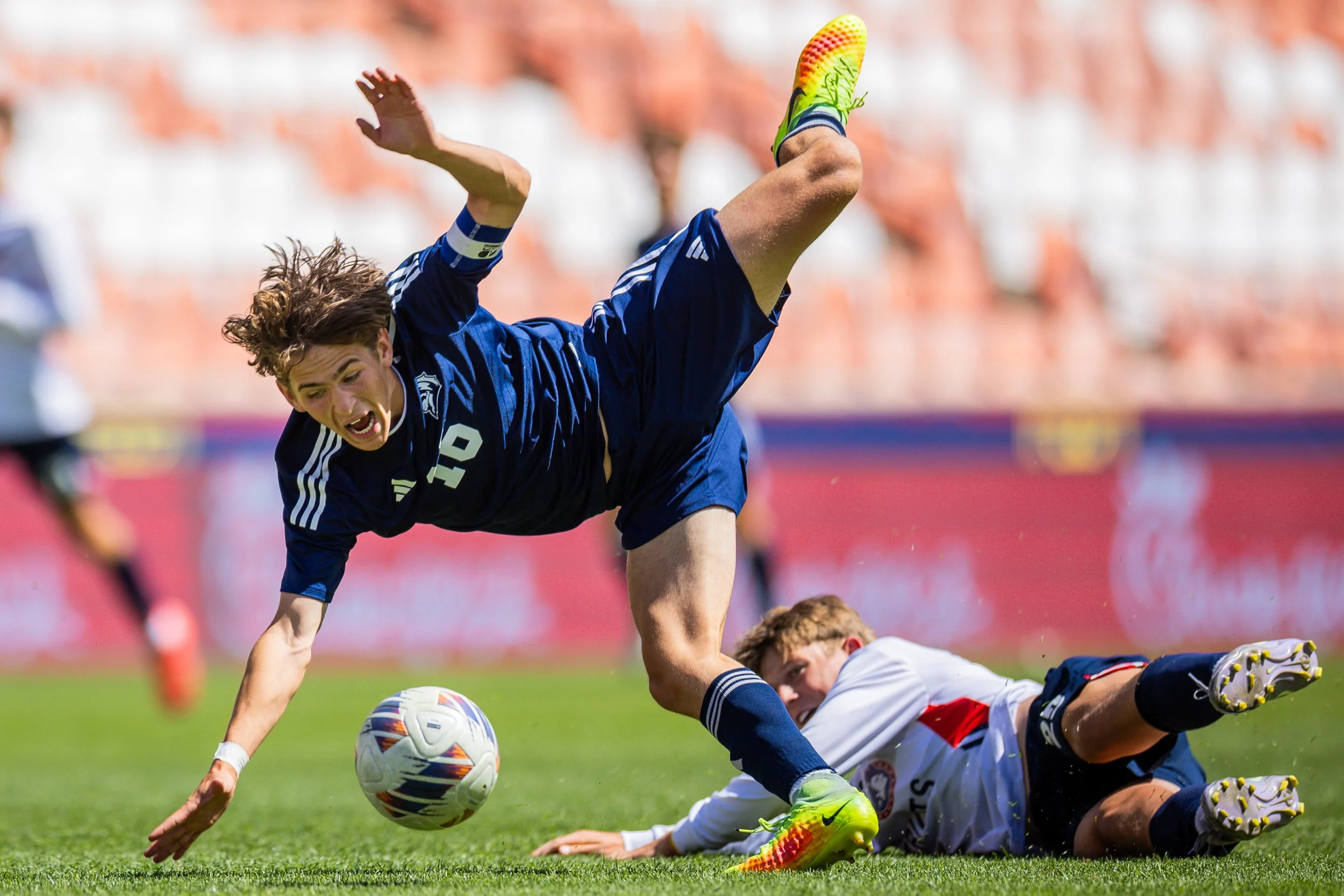  Maeser Prep Academy Lions Jack Stevenson (16) falls after losing control of the ball in the 2A boys soccer state championship against the American Heritage Patriots at America First Field in Sandy on Saturday, May 10, 2025.  