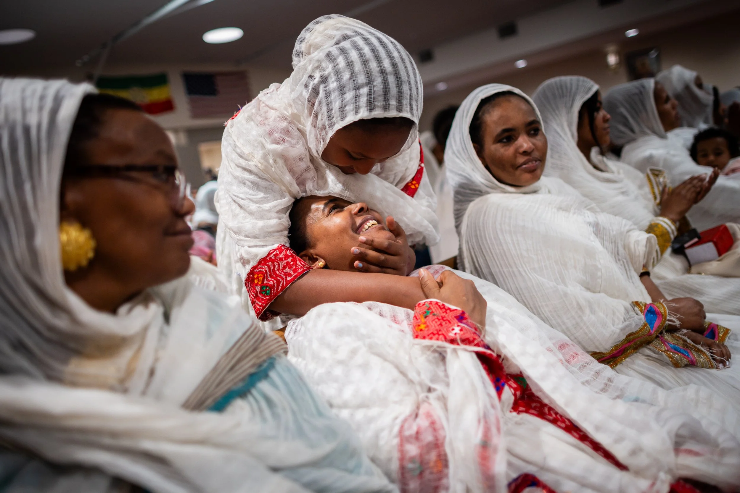  Yosan Zeray, 9, hugs her mother Shewit Drar during a celebration ceremony honoring the completion of the new St. Mary Ethiopian Orthodox Tewahedo Church in North Salt Lake on Saturday, June 28, 2025. 