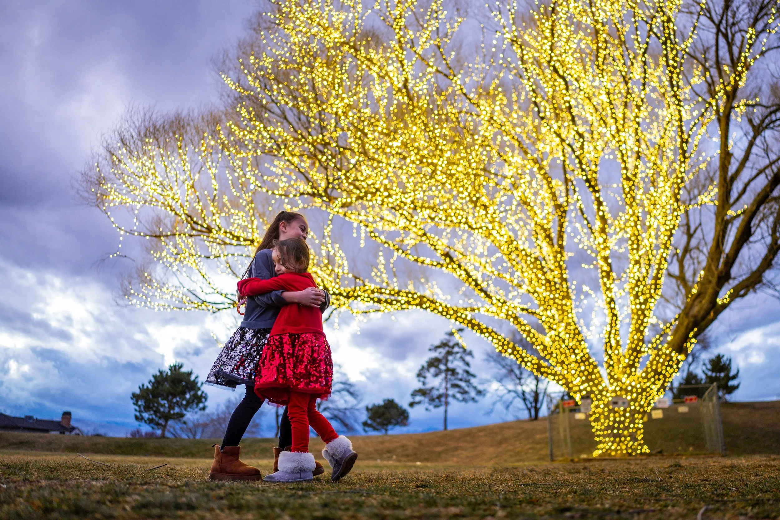  Sisters Amethyst Hall, 8, left, and Violet Hall, 5, right, from Sandy, admire the Christmas lights at Draper City Park in Draper on Wednesday, Dec. 17, 2025. 