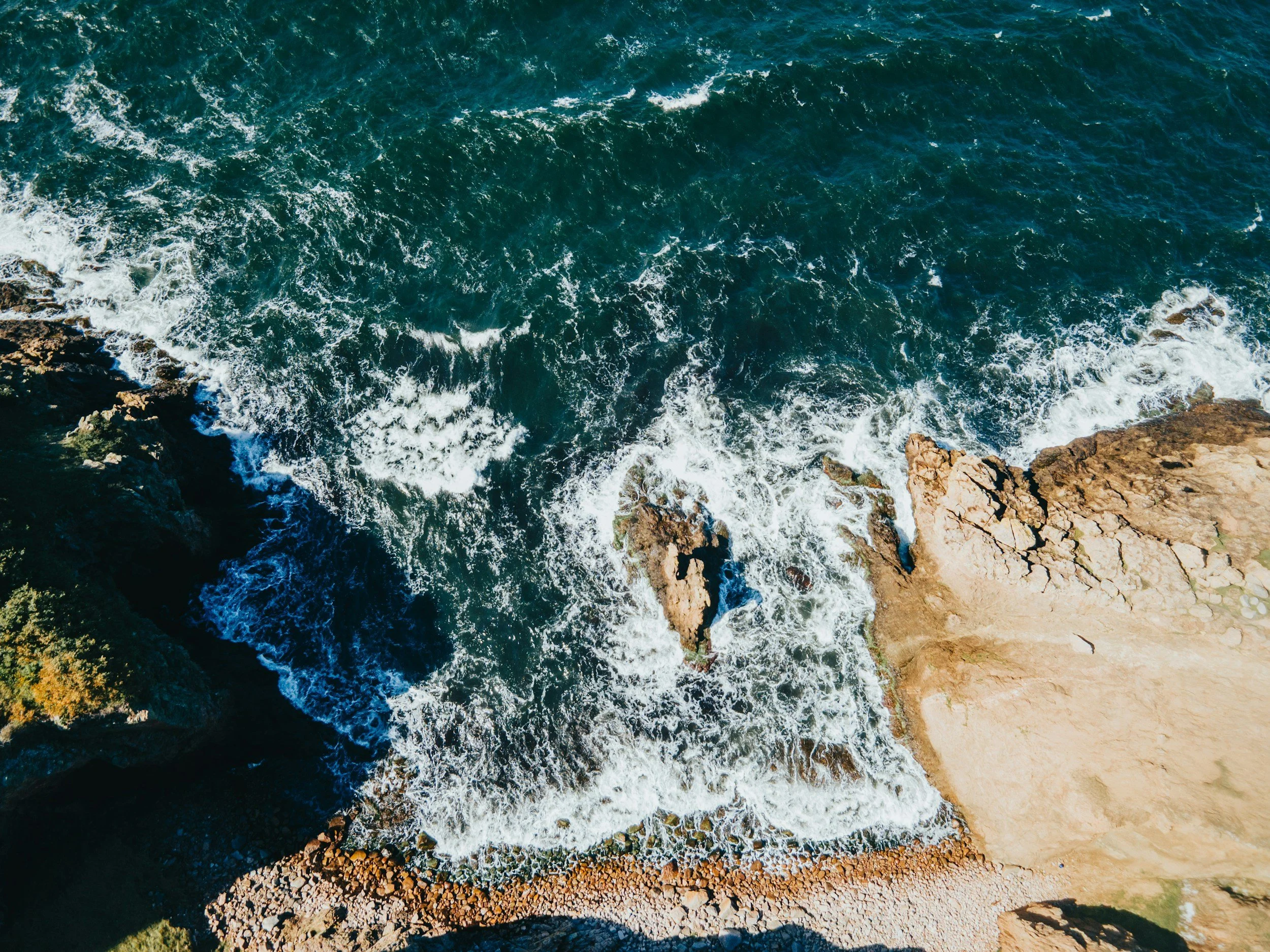 Rocky coastline and blue Baltic water on the Danish island of Bornholm.