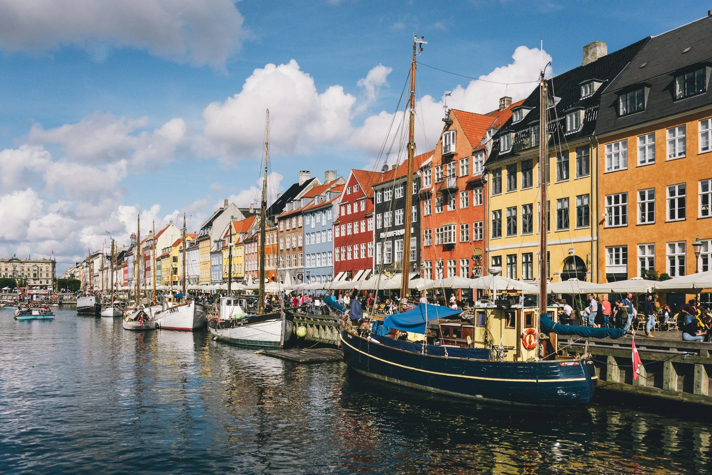 Colorful waterfront buildings and boats at Nyhavn in Copenhagen, Denmark.