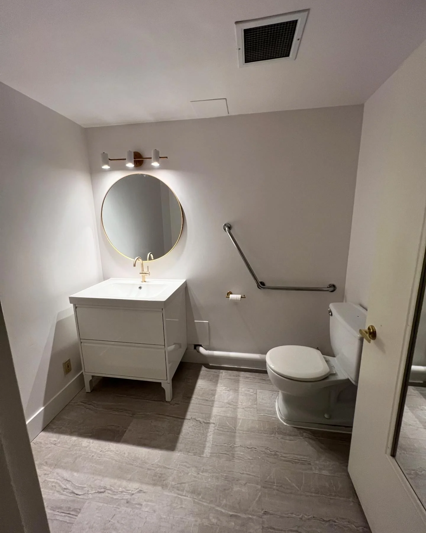 Quick bathroom Reno to repair water damaged materials.