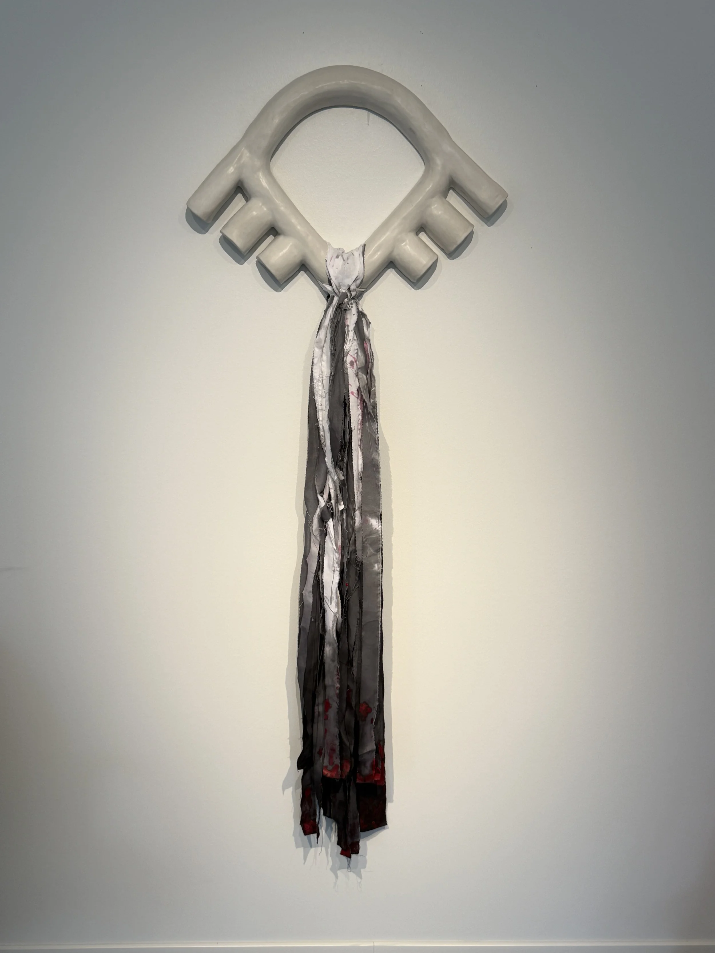 Shield | 2026 | Stoneware, cotton, encaustic