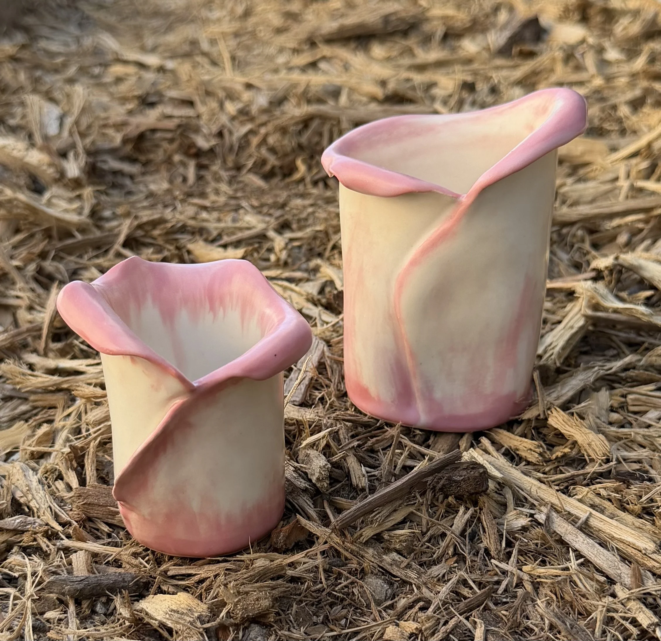 Ceramic flower cups 
From 3 to 8 inches in height, food safe