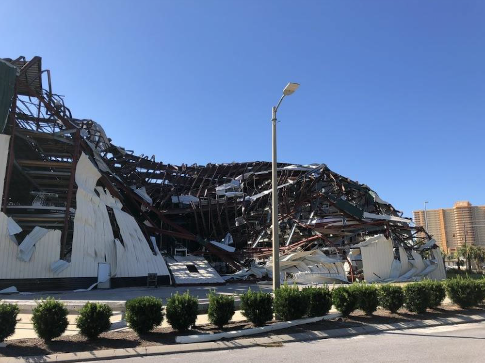 Still camera image of damaged large-volume building (StEER FAT1 EARR, 2018).