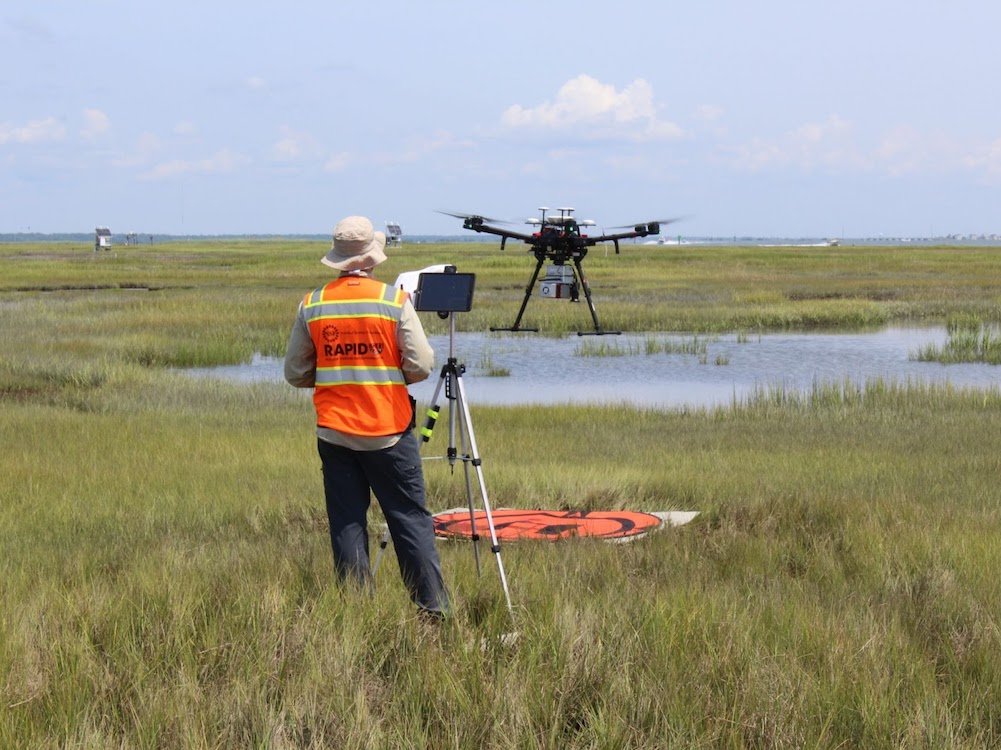 RAPID Staff collecting drone-based lidar of coastal marsh restored using dredged material, in Gull Island, NJ.