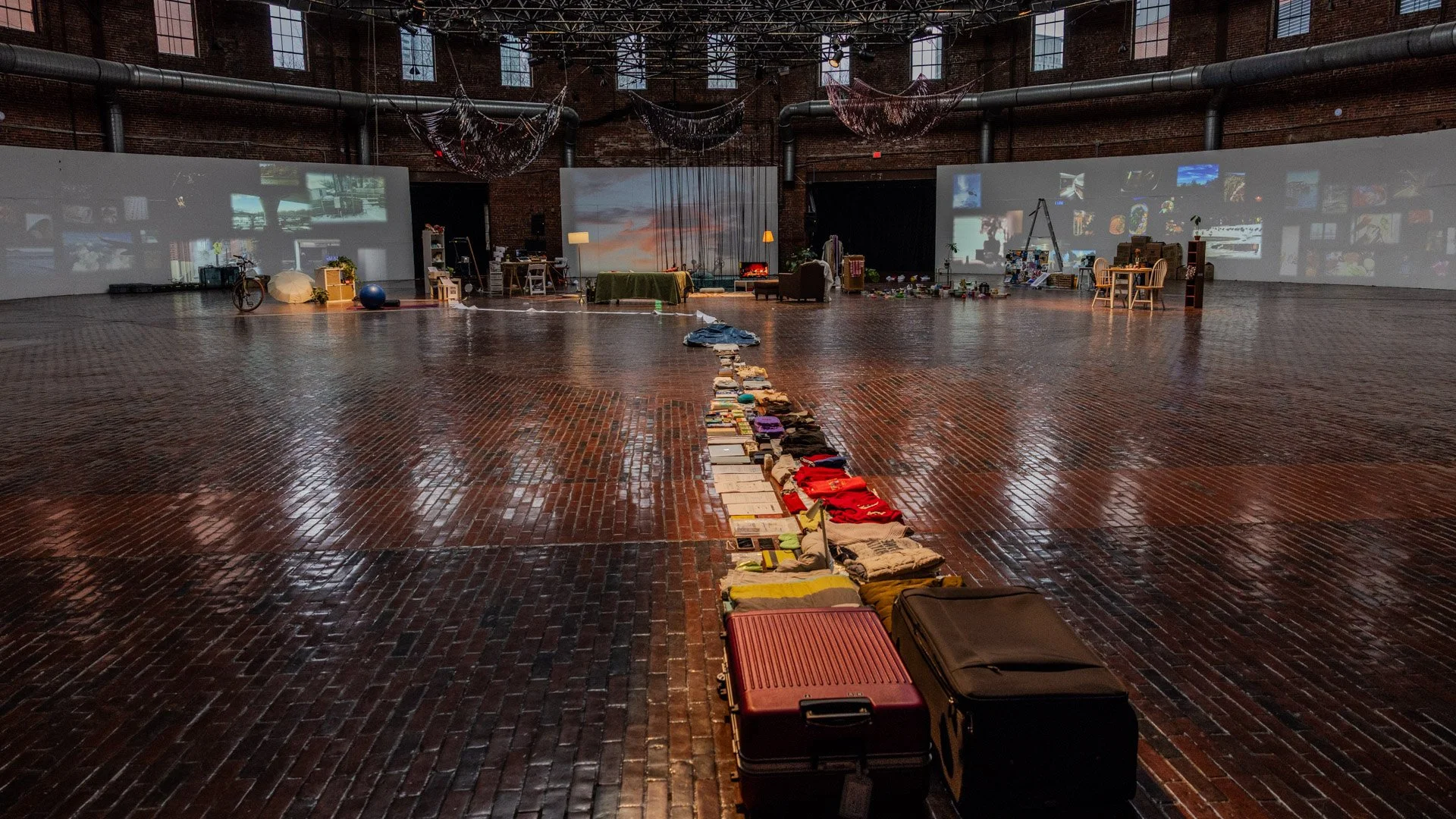 Journey to Home, Multimedia, Furniture, projection, suitcase, plants, 2026
