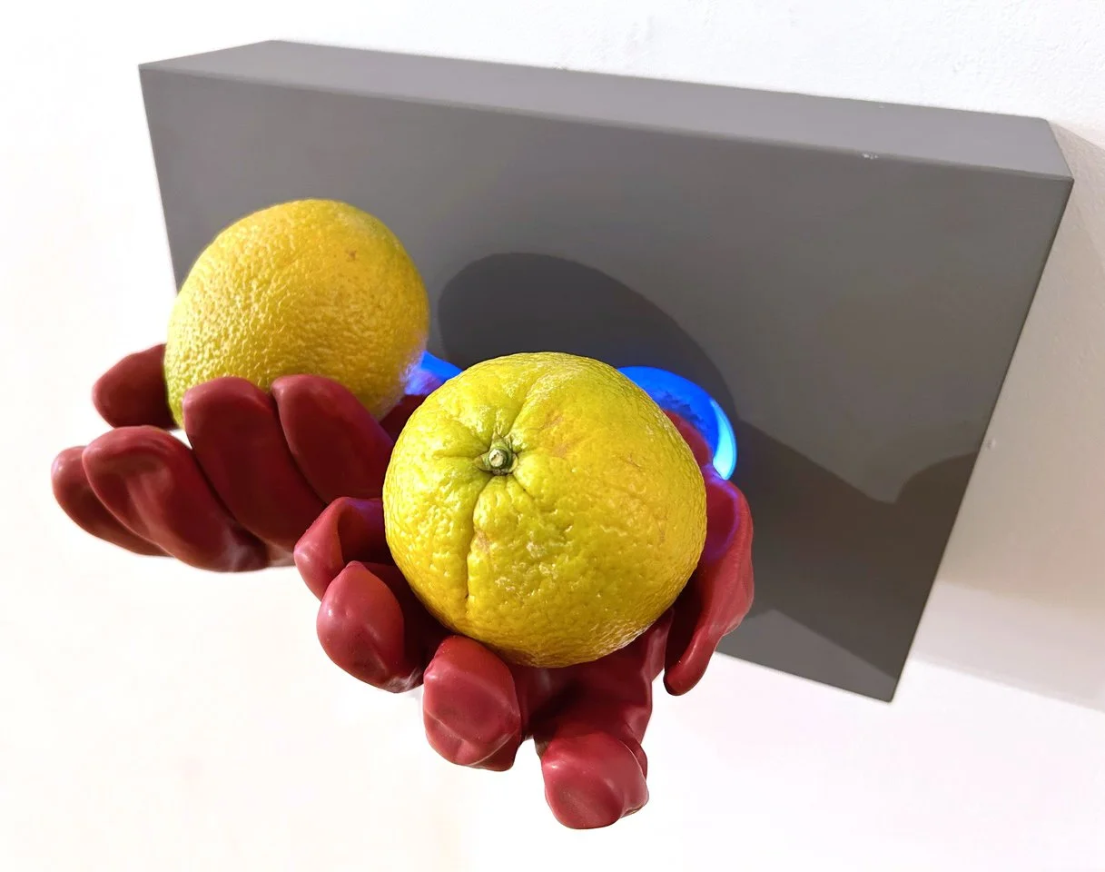 Fruit stand,
oranges, vinyl gloves, wood, lighting