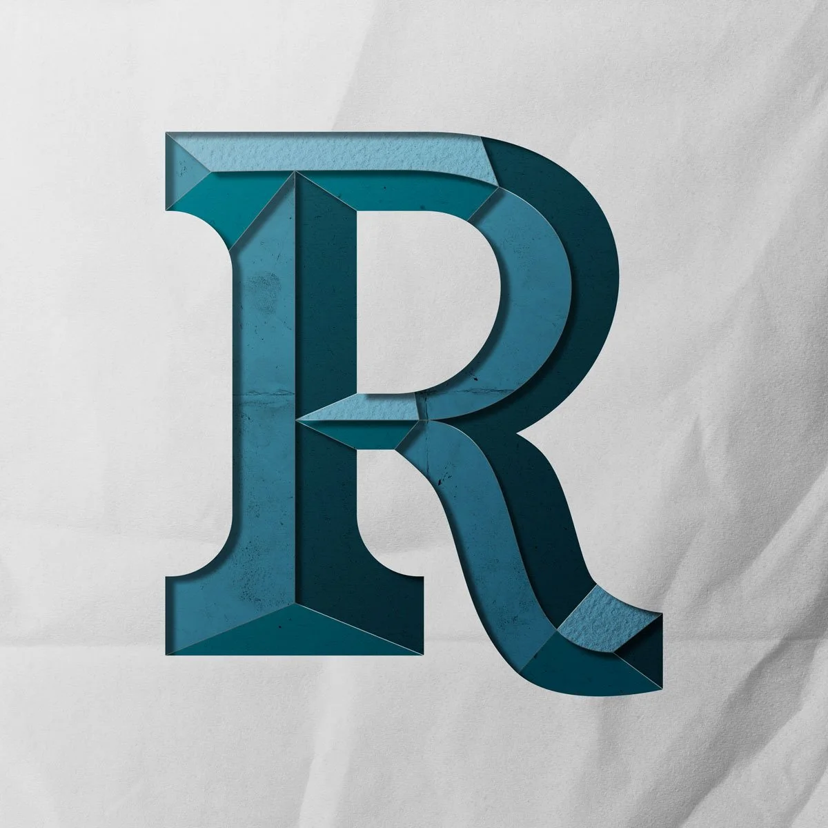 Capital letter R cut out from paper