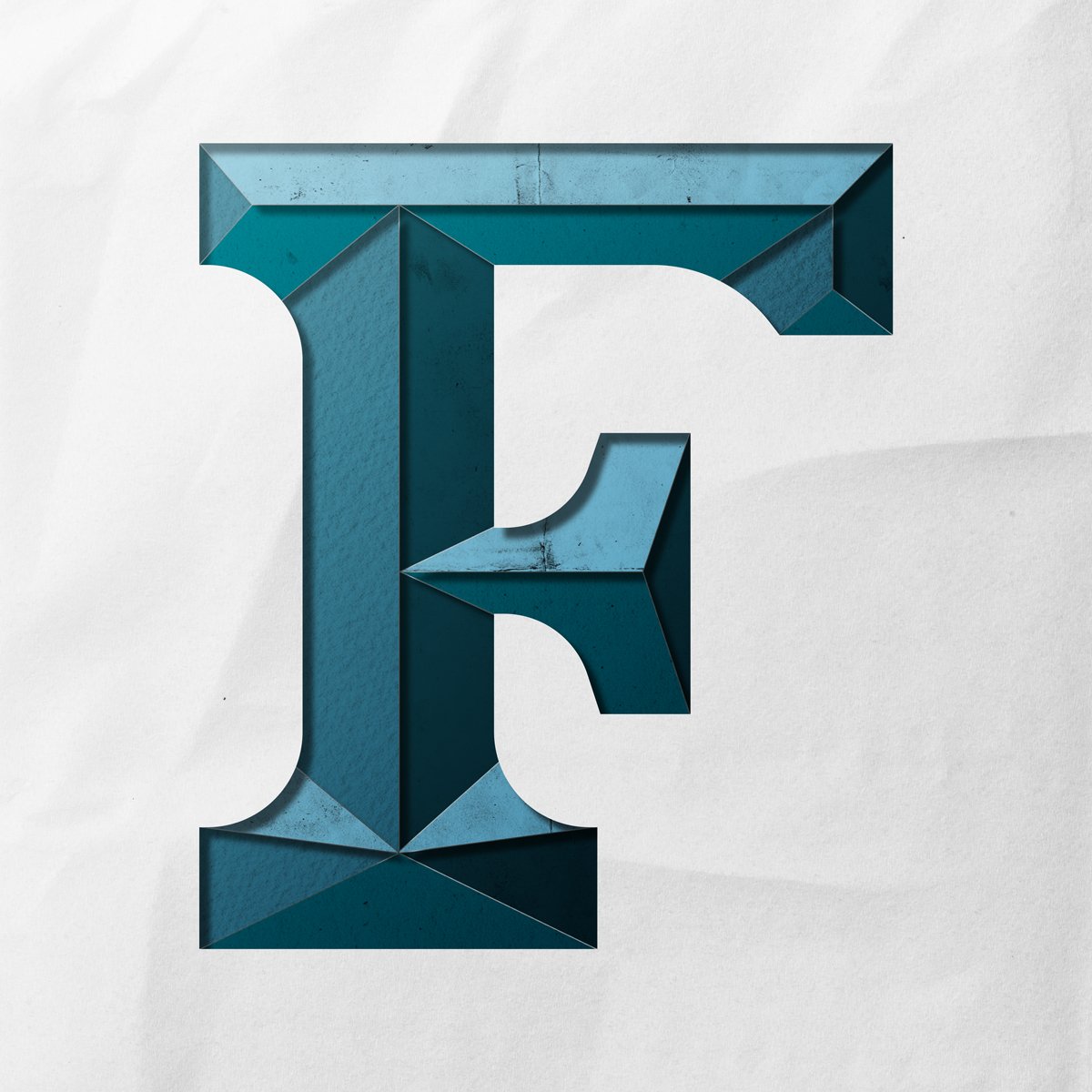 Capital letter F cut out from paper