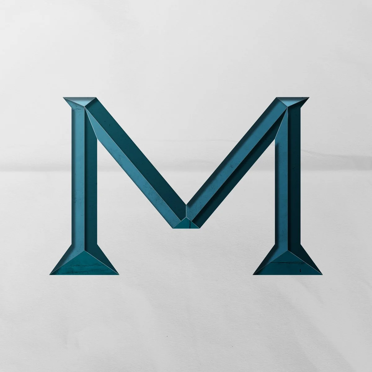 Capital letter M cut out from paper