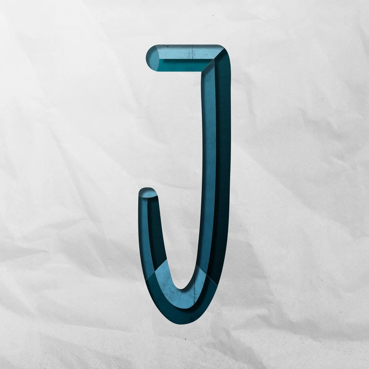 Condensed, Capital letter J cut out from paper