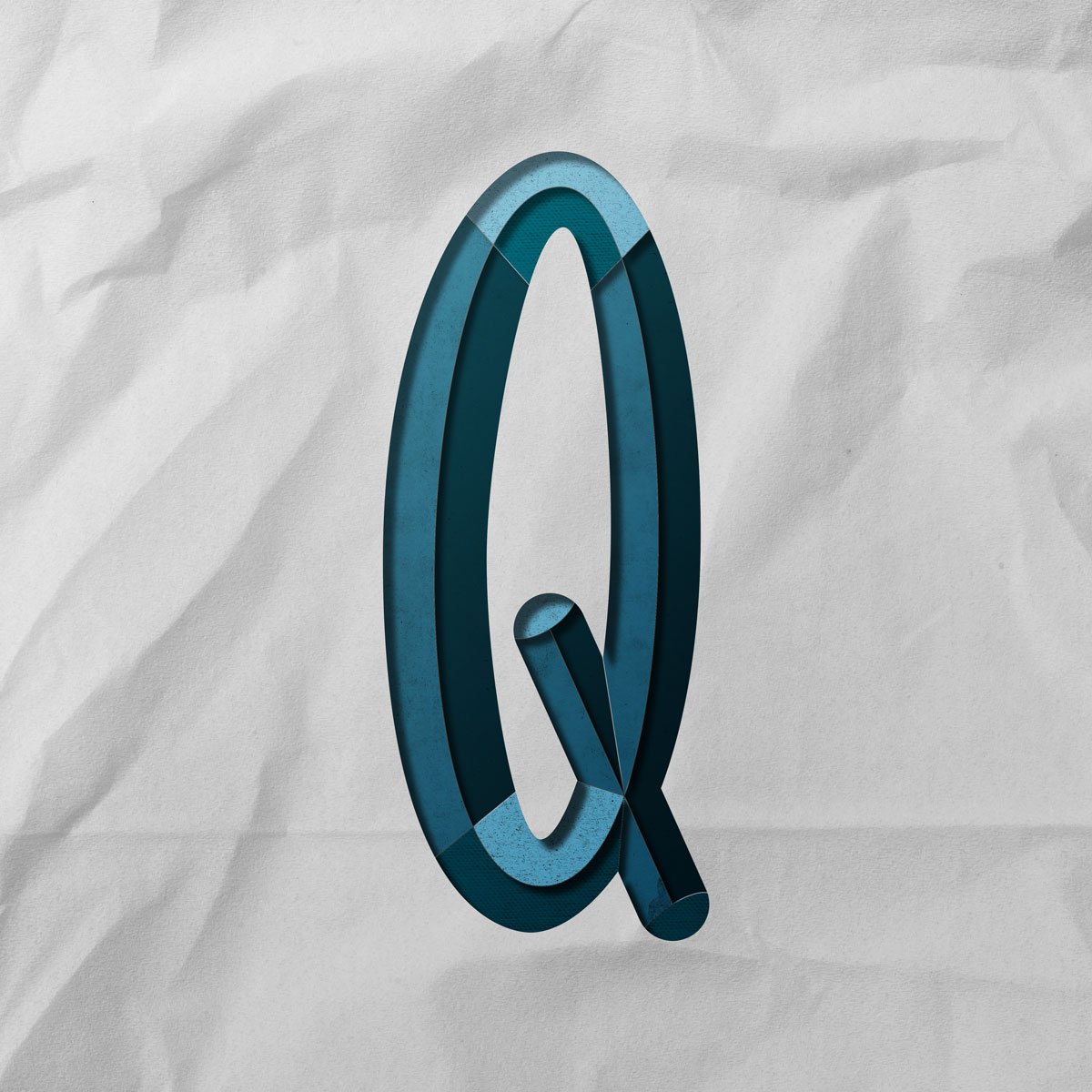 Capital letter Q cut out from paper