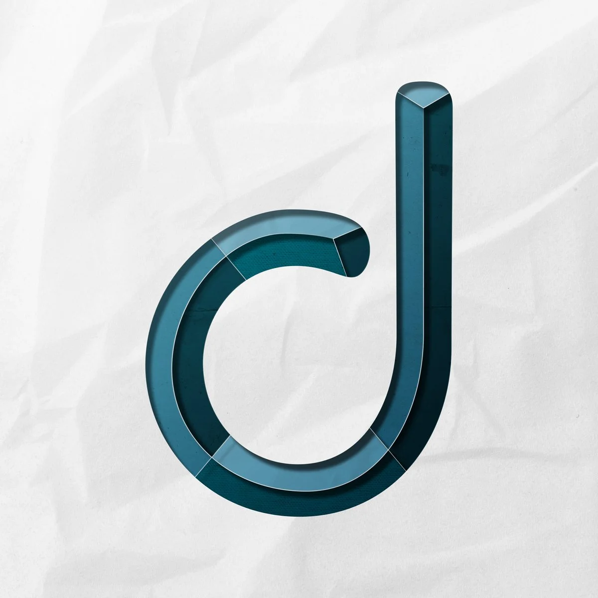 Lowercase letter d cut out from paper